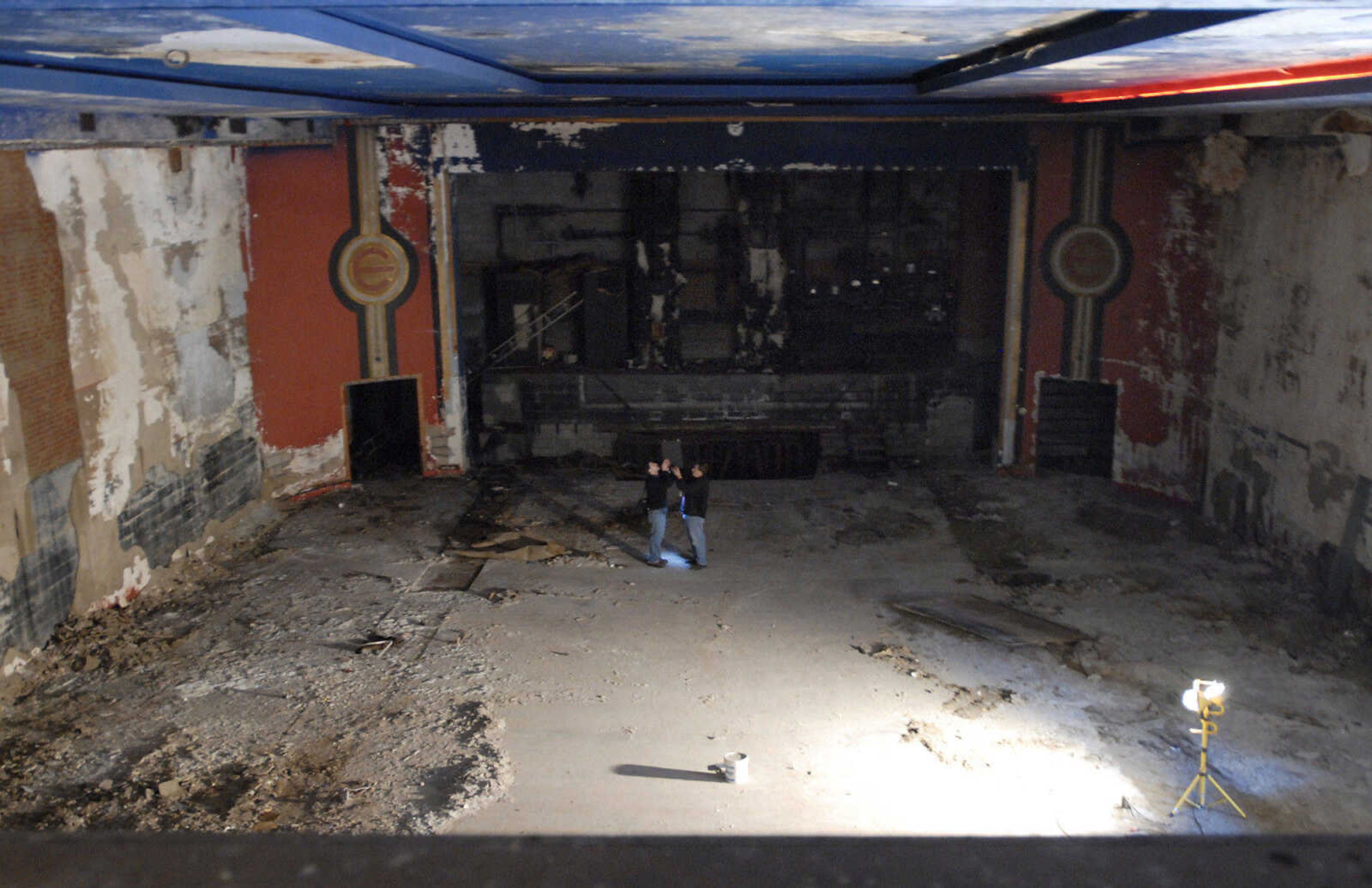 KRISTIN EBERTS ~ keberts@semissourian.com

David Leavey, left, of Kiku Obata & Company, and Glen Hinkebein, right, of Penzel Construction, work to take measurements of the Esquire Theater building on Friday, Jan. 6, 2012, in Cape Girardeau. Renovation work on the Esquire Theater continues as workers from Kiku Obata & Company and Penzel Construction complete field verification work and take measurements necessary for the design plans.