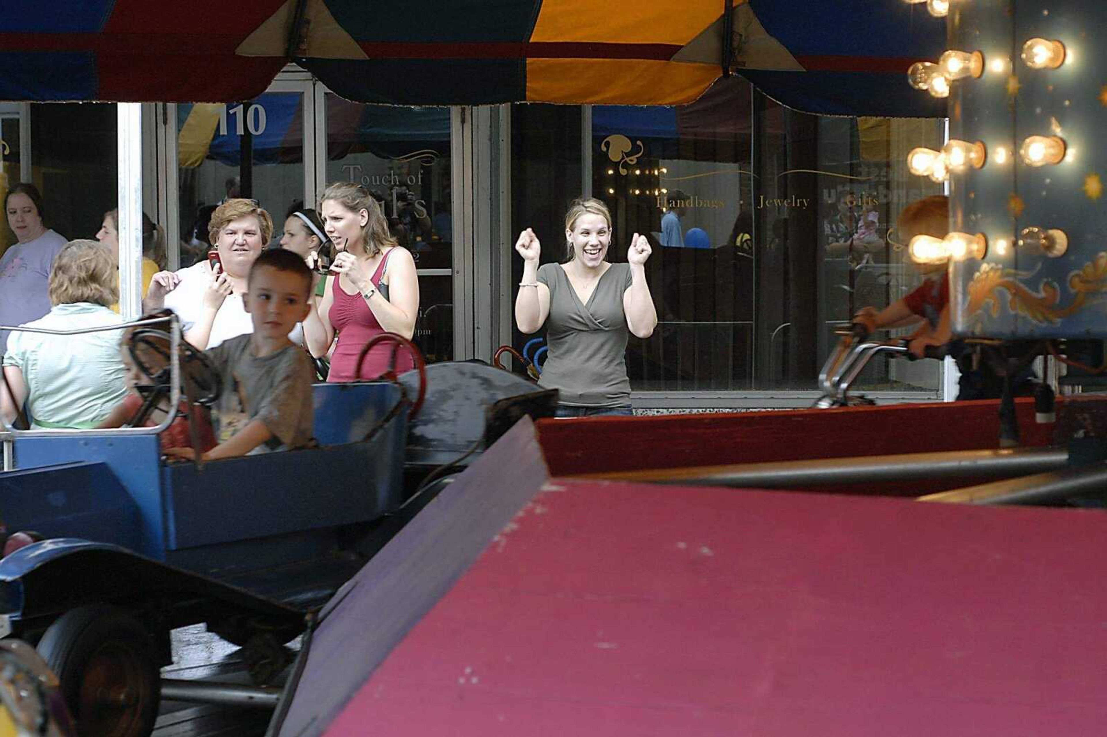 KIT DOYLE ~ kdoyle@semissourian.com
Natalie Ruesler cheered as her nephews passed on a ride Friday, July 25, 2008, at Jackson Homecomers.