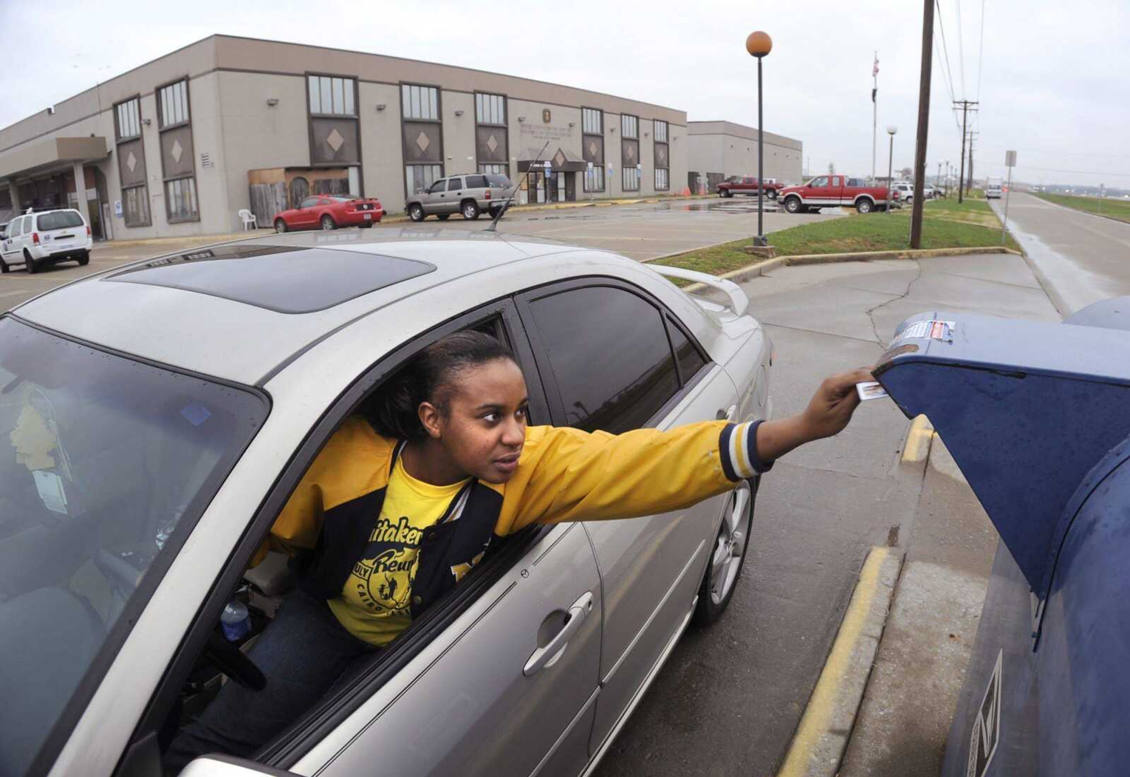 Ceneca Woods mails a letter Monday, Dec. 5, 2011 outside the Richard G. Wilson Processing and Distribution Facility on Kell Farm Drive in Cape Girardeau. (Fred Lynch)