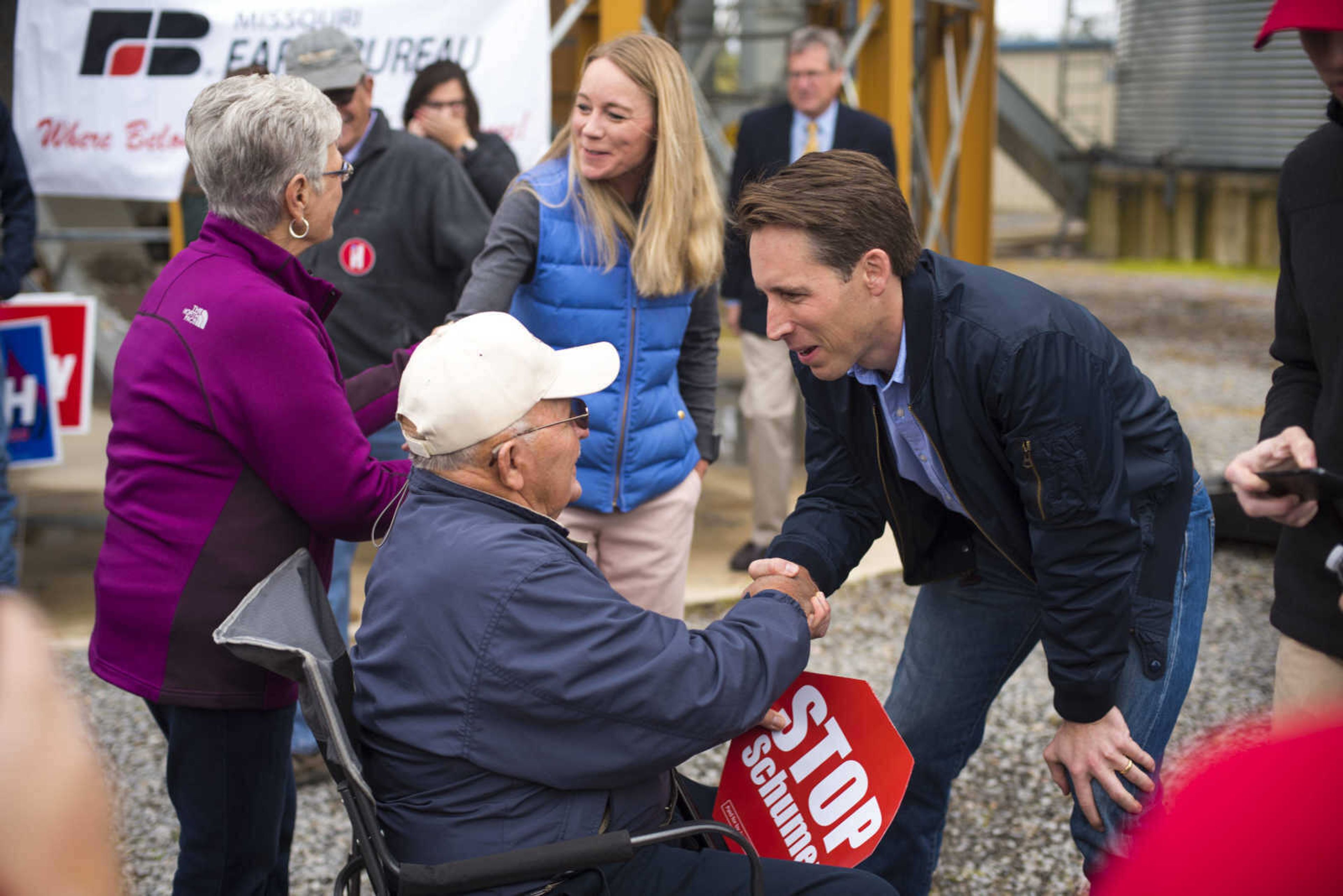 Missouri Republican candidate Josh Hawley, far right, and his wife Erin Morrow Hawley shake hands with Dale and Helend Steffens, respectively, after a campaign rally Friday, Oct. 26, 2018, in Scott City.