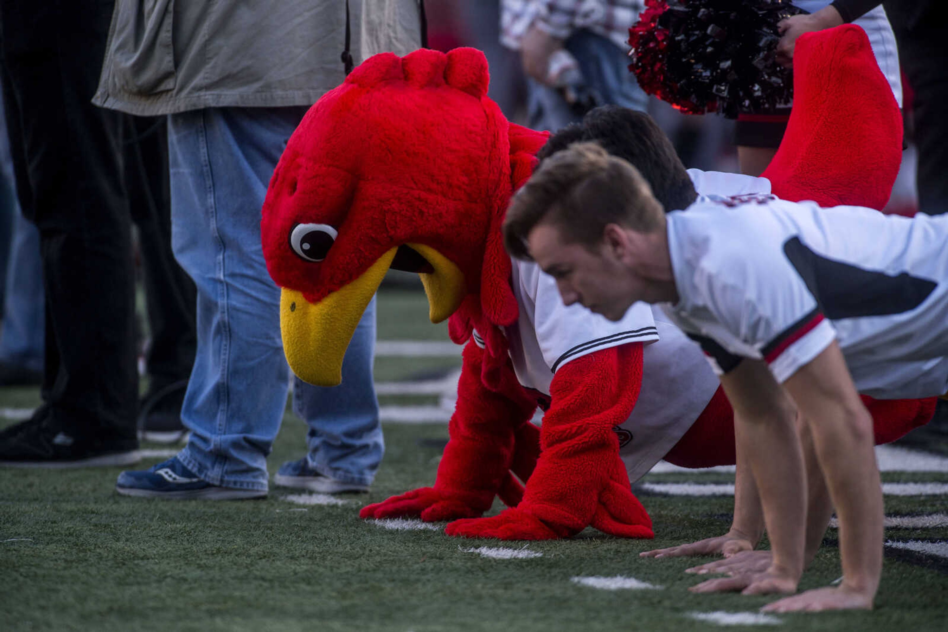 Southeast cheerleaders try to best mascot Rowdy the Redhawk in a push-up competition on the sidelines during Southeast's 28-14 victory over Stony Brook at Houck Stadium Saturday, Nov. 24, 2018.