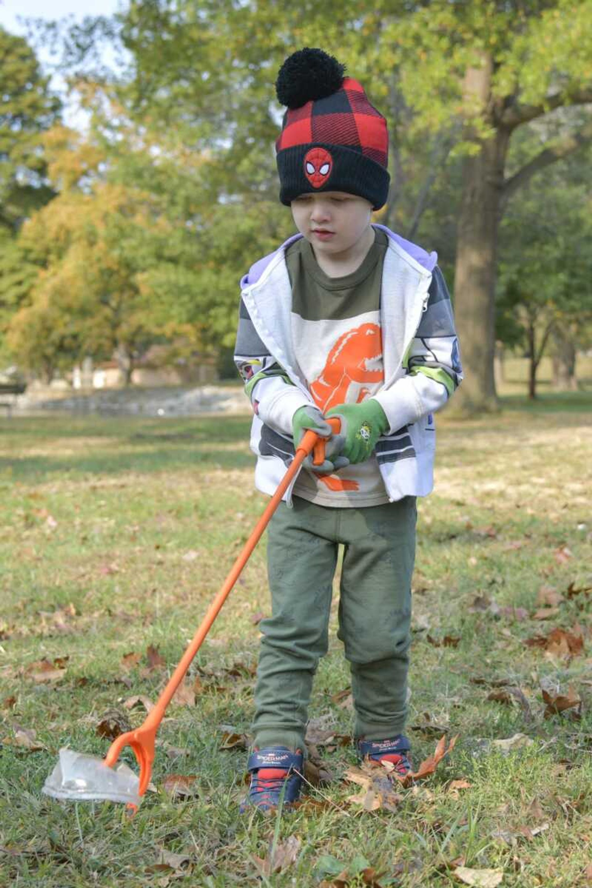 Cooper McGuire, 4, picks up a plastic dome lid at Capaha Park in Cape Girardeau on Oct. 17, 2020.