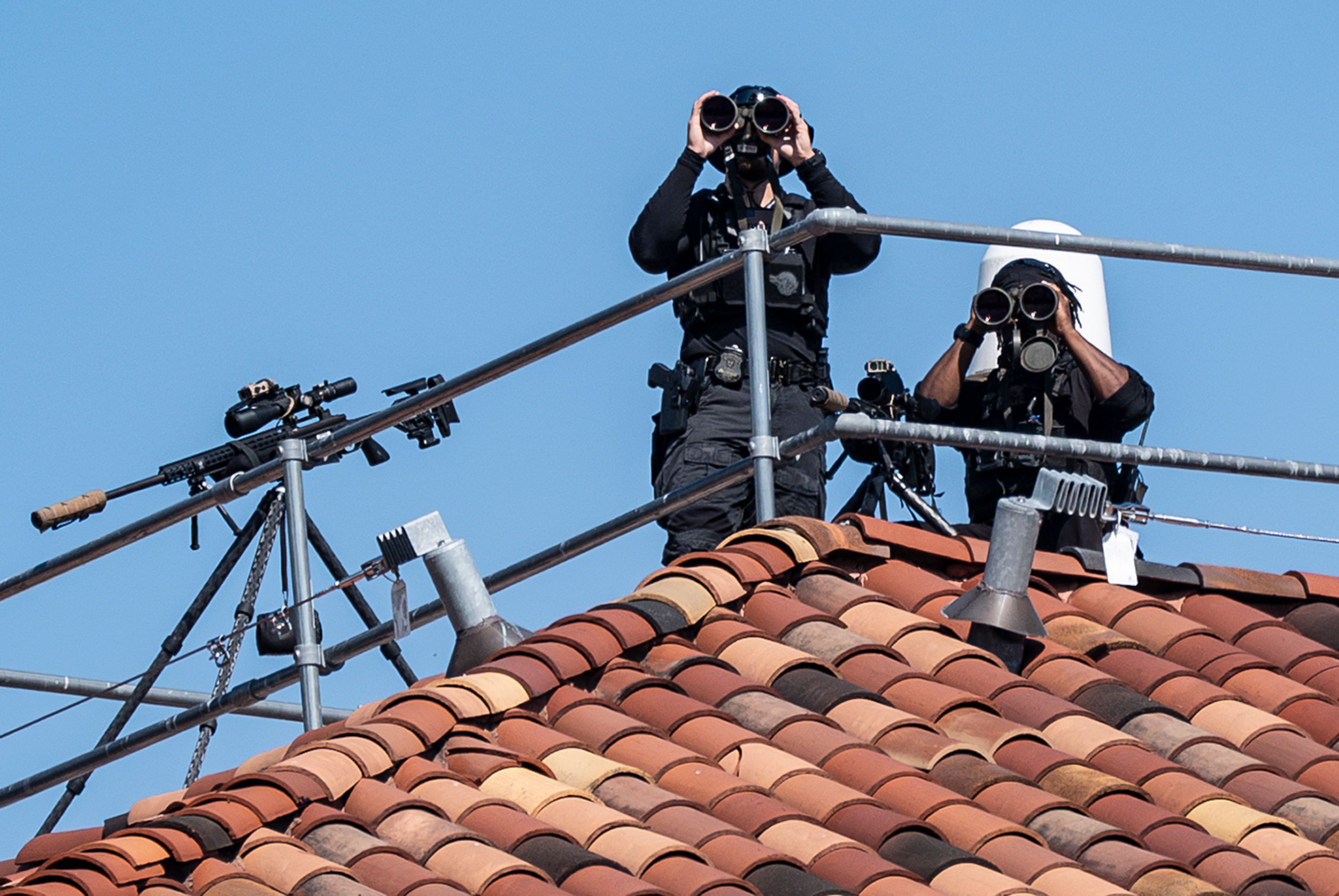 A counter-sniper team on the roof of the Commerce Department watches over a pro-Israel event attended by Republican Vice Presidential nominee Sen. JD Vance, R-Ohio, during a rally marking one year since the Oct. 7 Hamas terror attack on Israel, in Washington, Monday, Oct. 7, 2024. (AP Photo/J. Scott Applewhite)