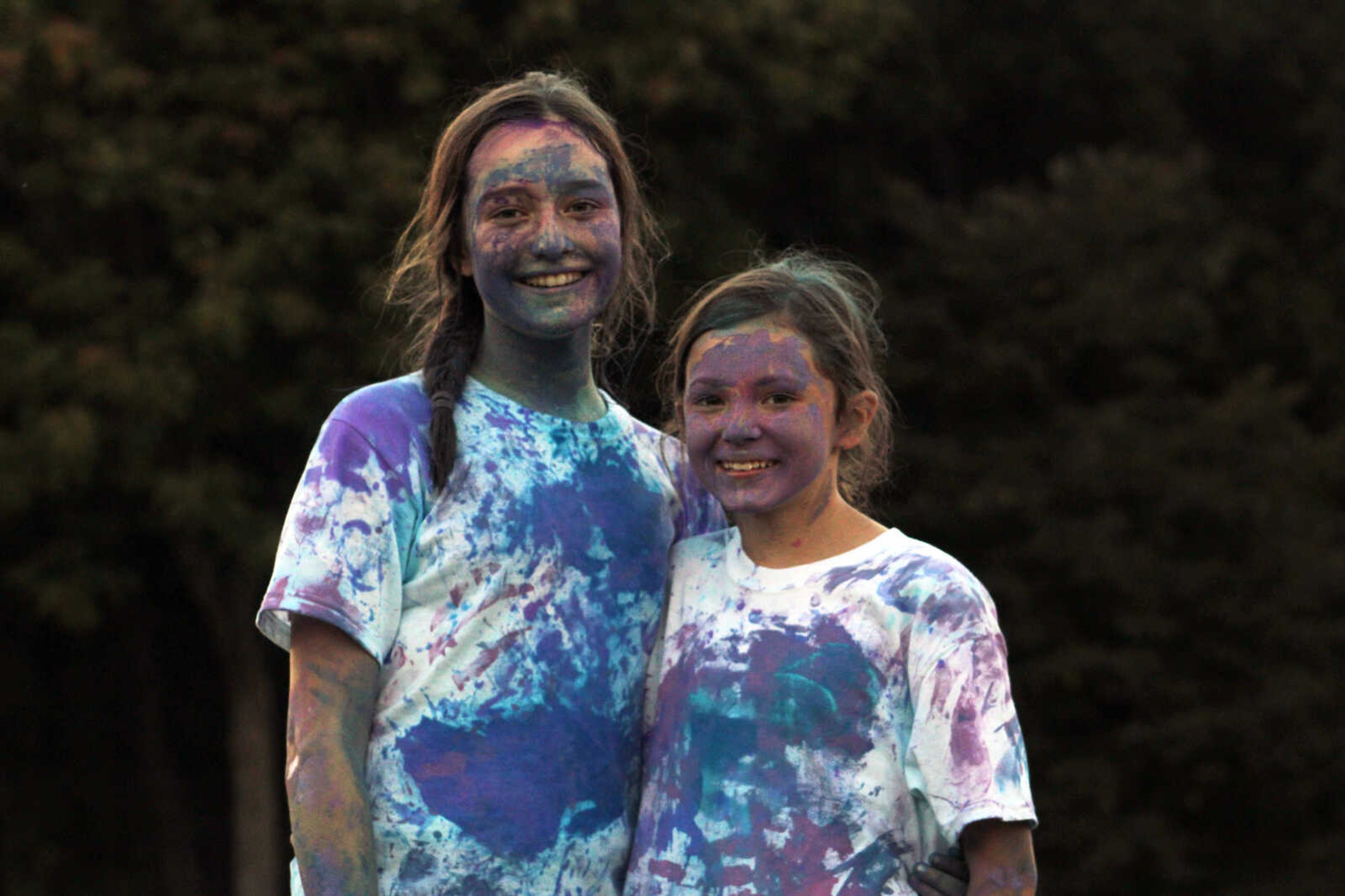 Mya McNew, 12, left, poses for a photo with friend Averie Jackson, 12, after participating in Paint Wars at Lynwood Baptist Church in Cape Girardeau Wednesday, Sept. 15, 2021.