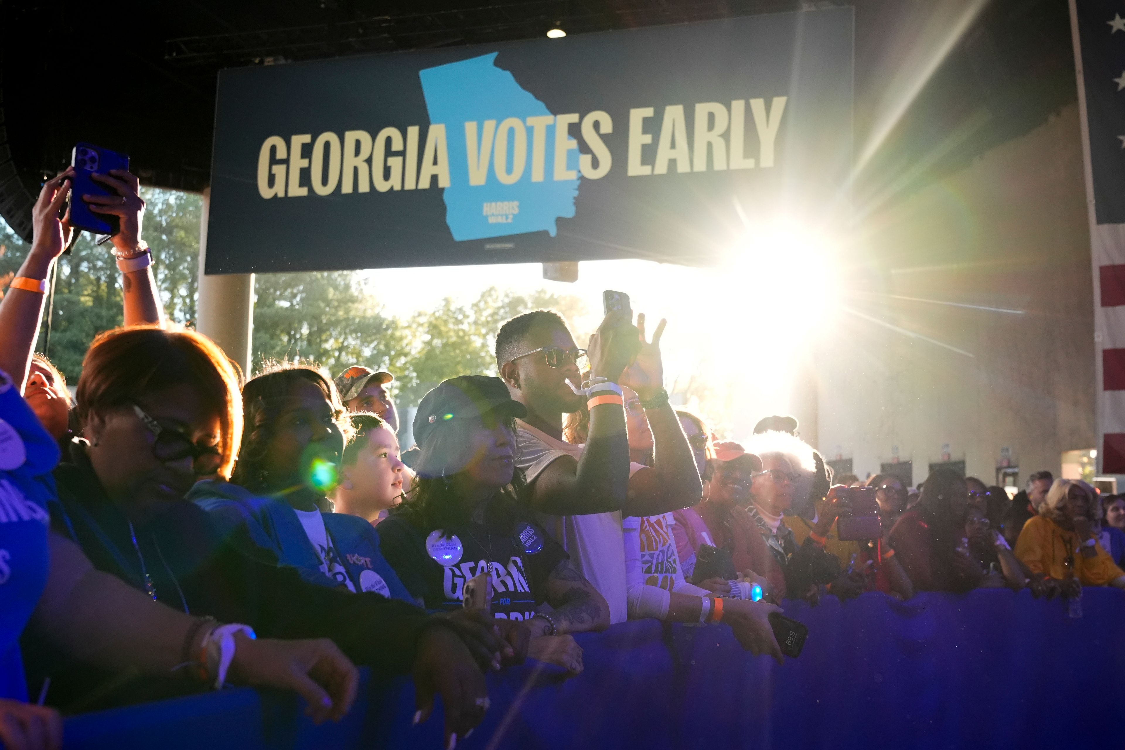 People arrive for a campaign event for Democratic presidential nominee Vice President Kamala Harris at Lakewood Amphitheatre, Saturday, Oct. 19, 2024, in Atlanta. (AP Photo/Jacquelyn Martin)