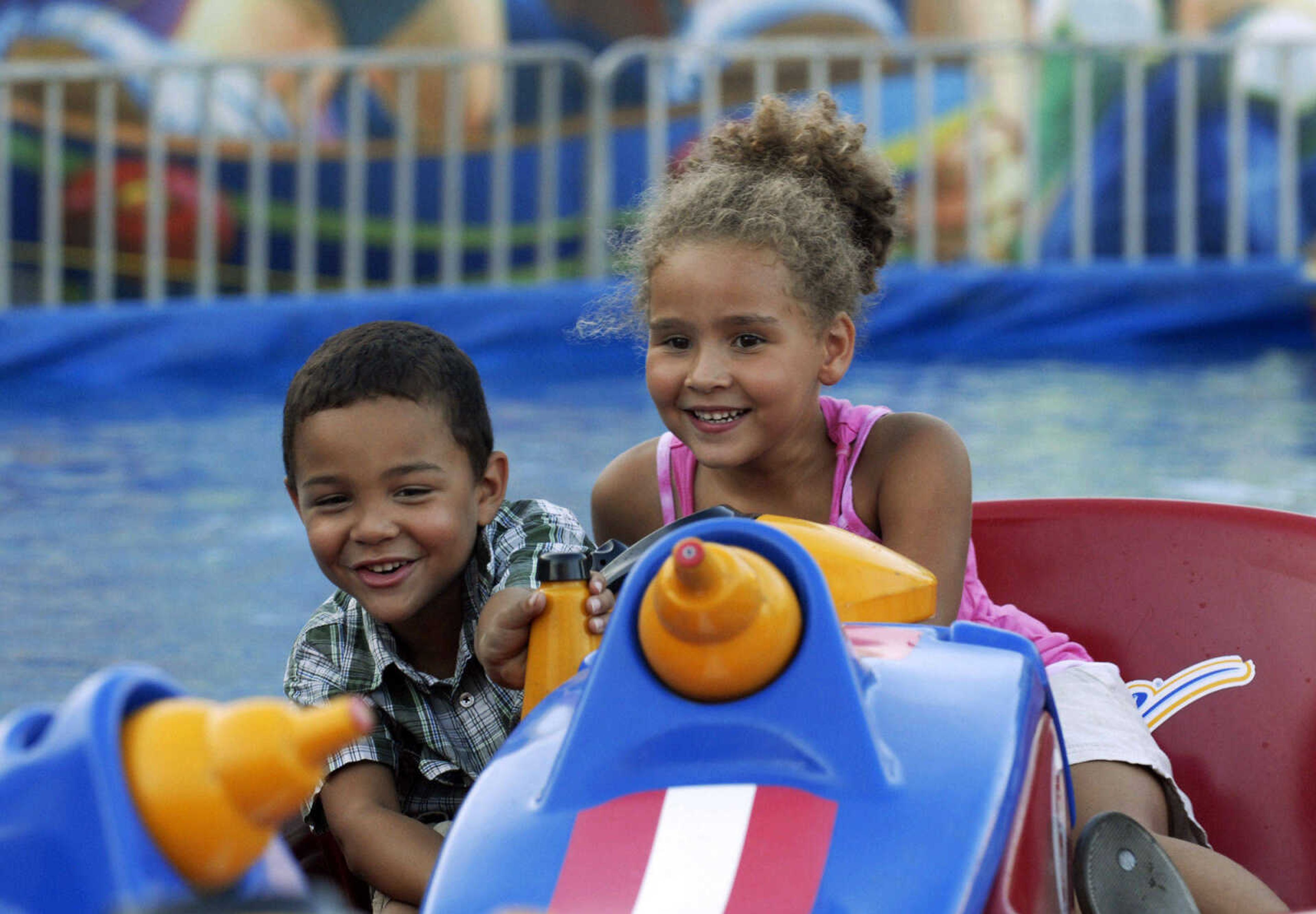 KRISTIN EBERTS ~ keberts@semissourian.com

Caden Marx, 5, and Kyra McGee, 5, drive the bumper boats at the 102nd Annual Homecomers Celebration in downtown Jackson on Tuesday, July 27, 2010. Tuesday marked the opening day of the celebration, which lasts through Saturday.