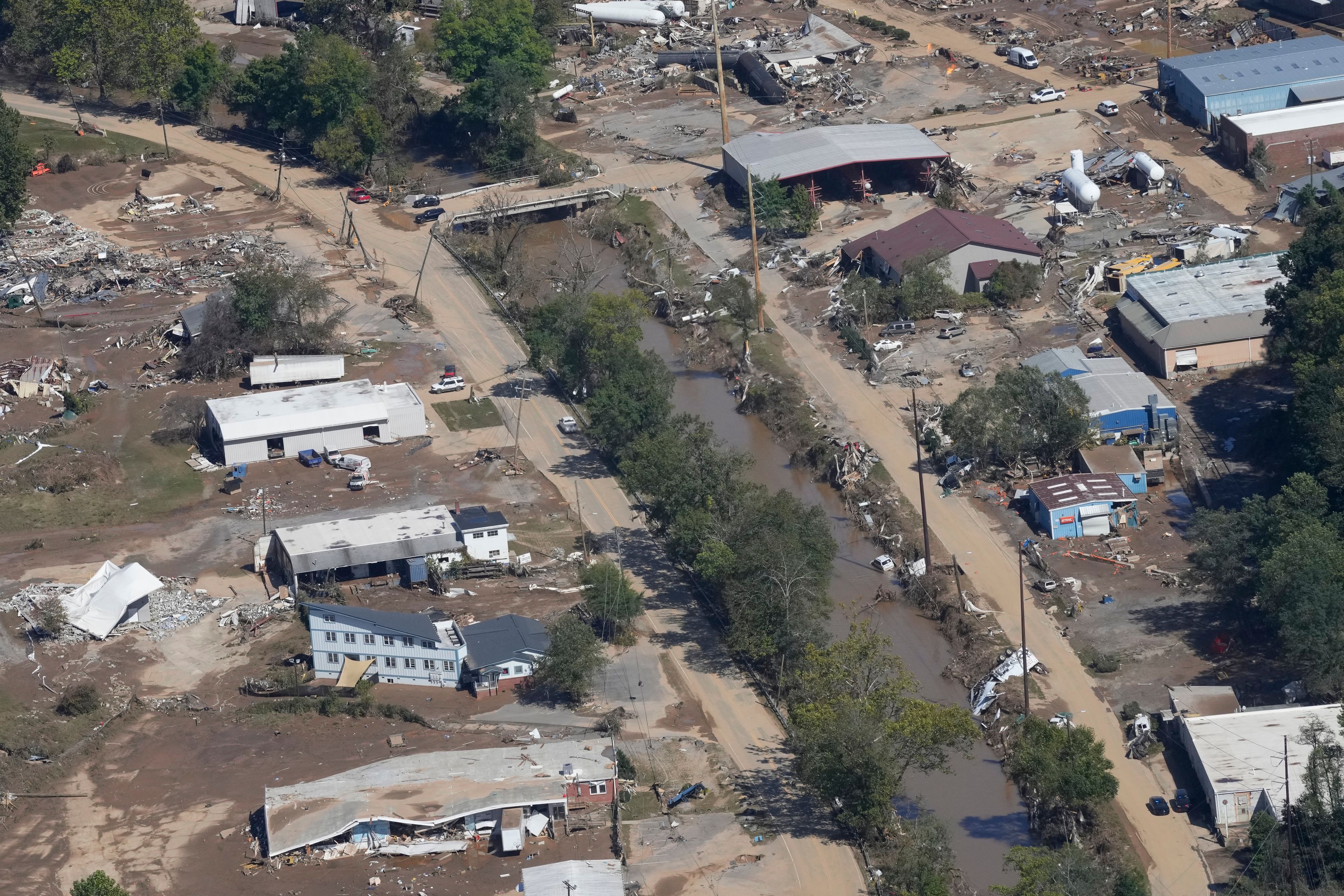 FILE - A view of damage in Asheville, N.C., is seen during an aerial tour with President Joe Biden who looked at areas impacted by Hurricane Helene near Asheville, N.C., Wednesday, Oct. 2, 2024. (AP Photo/Susan Walsh, File)