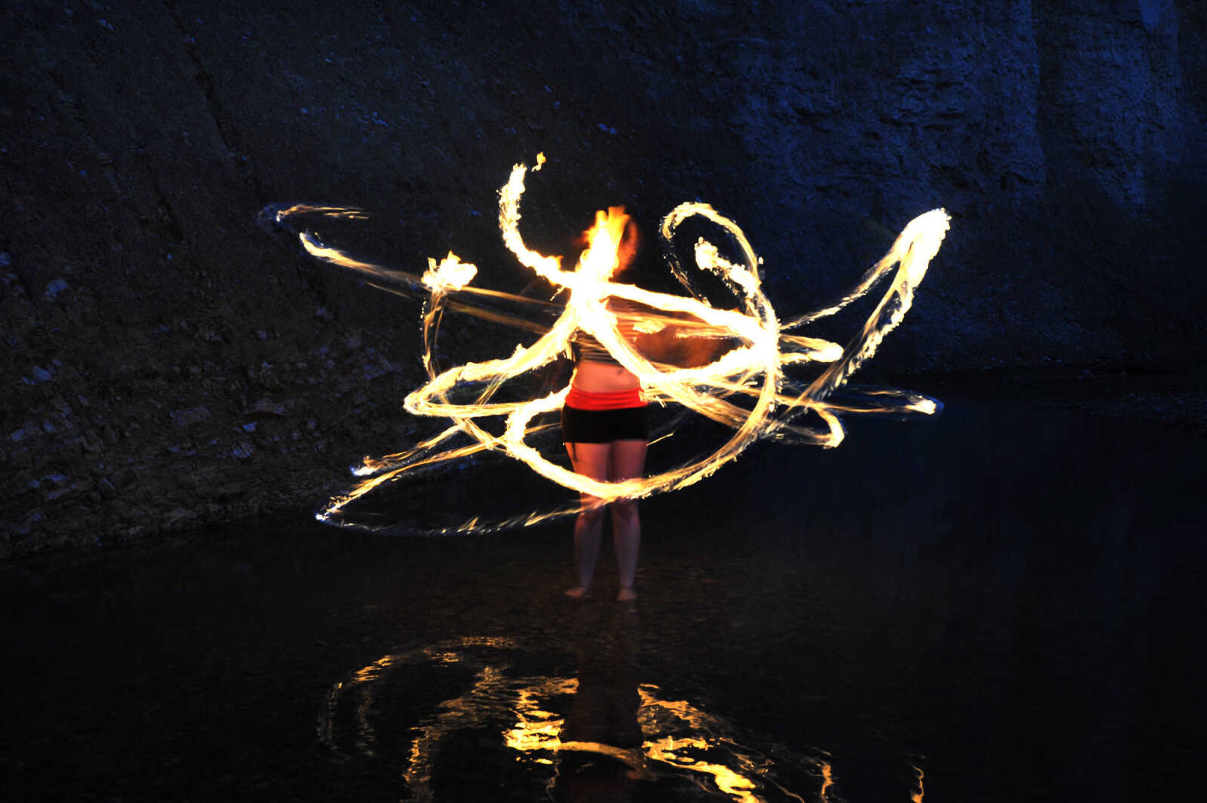 LAURA SIMON ~ lsimon@semissourian.com

Chelsie Welker fire hoops in a Cape Girardeau County creek, Tuesday, May 26, 2015.