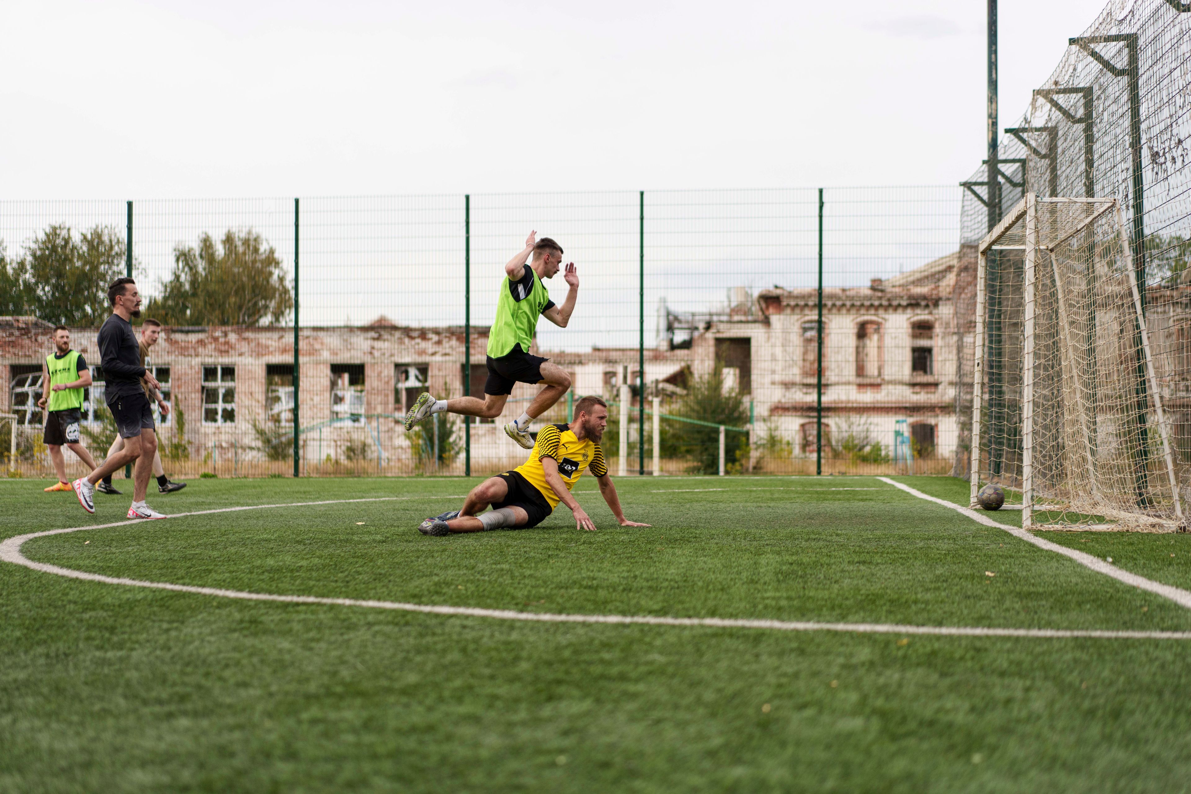 Ukrainian servicemen of the 3rd assault brigade play soccer in Izium, Ukraine, Thursday Sept. 26, 2024. (AP Photo/Evgeniy Maloletka)