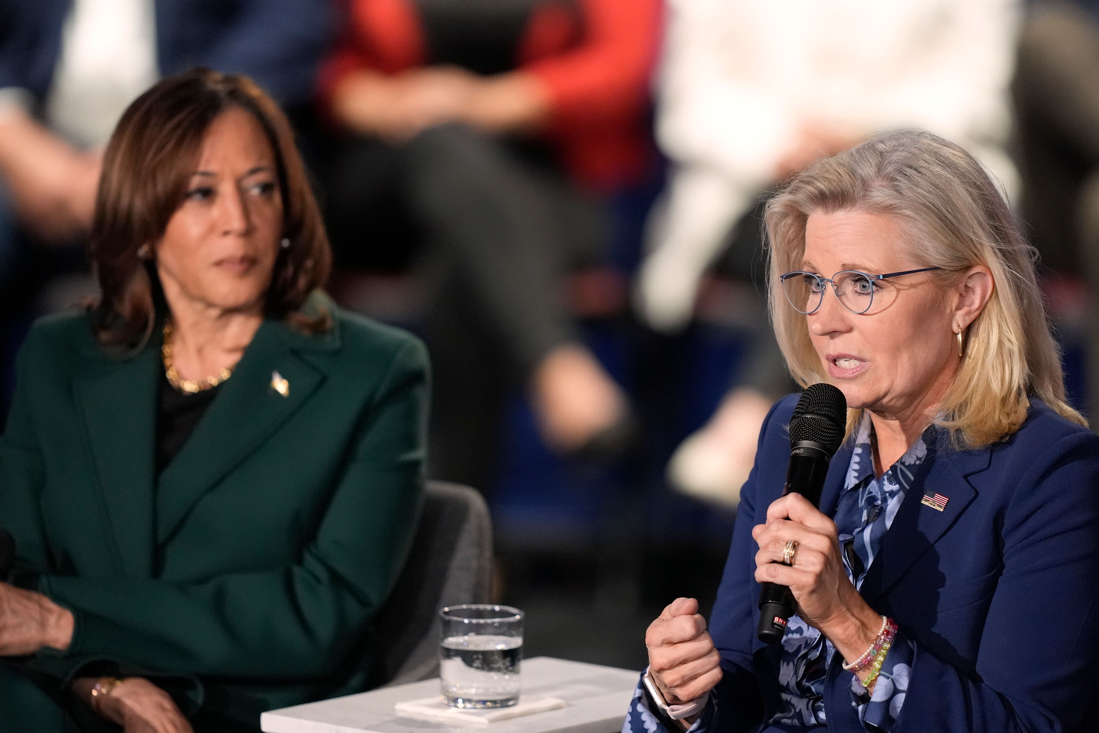 Former Republican Congresswoman Liz Cheney speaks as Democratic presidential nominee Vice President Kamala Harris listens during a town hall at the Royal Oak Theatre in Royal Oak, Mich., Monday, Oct. 21, 2024. (AP Photo/Carlos Osorio)