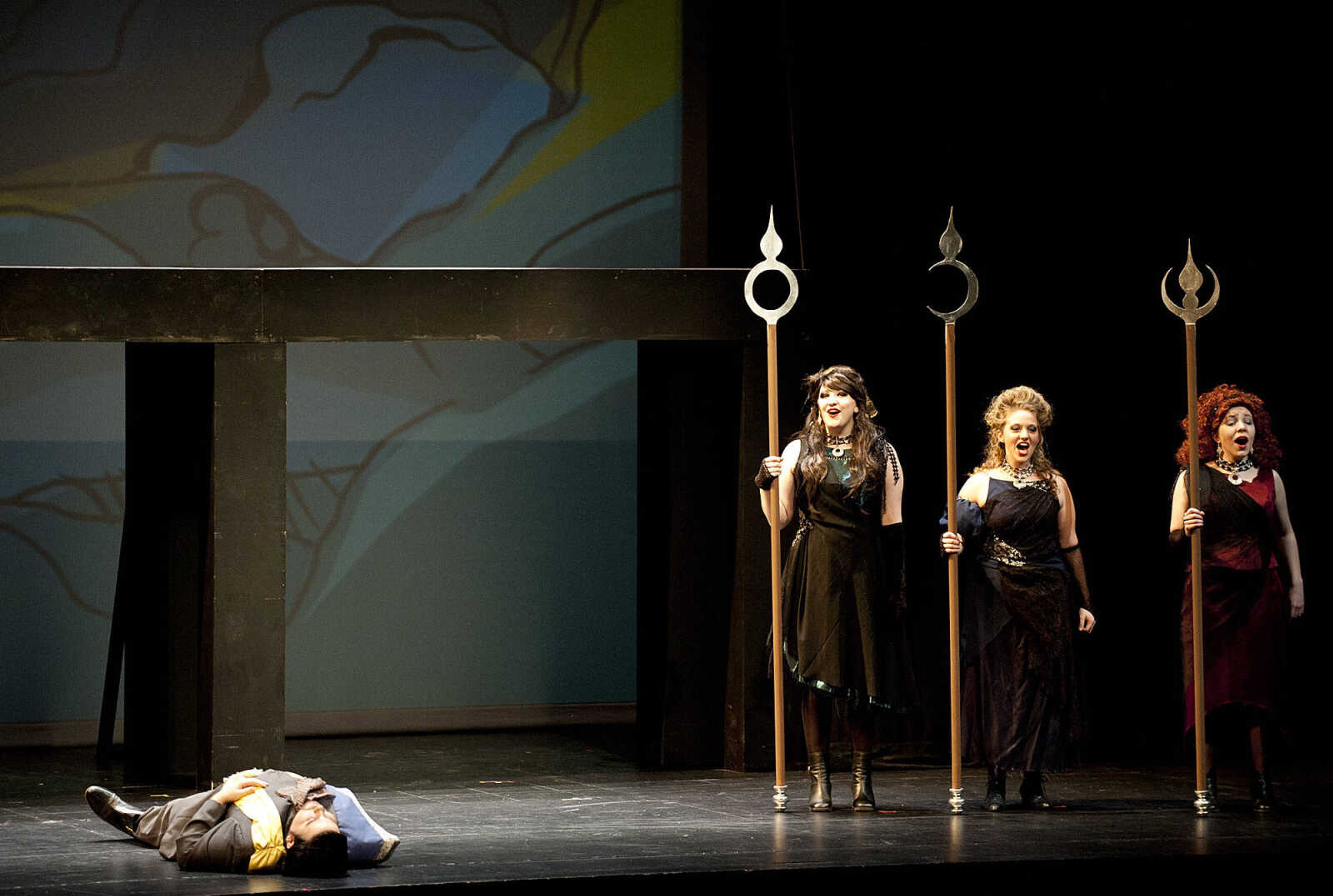 Kaitlyn Robinson, left, Vikki Siddell and Elena Arredondo perform with Andrew Thomas, as Prince Tamino, during the Southeast Missouri State University Department of Music's production of "The Magic Flute," Saturday, Feb. 1, at the Bedell Performance Hall. Southeast's production of the opera, by Wolfgang Amadeaus Mozart, has dialog in English while the songs are sung in the original German and features guest artist Alba Cancel.