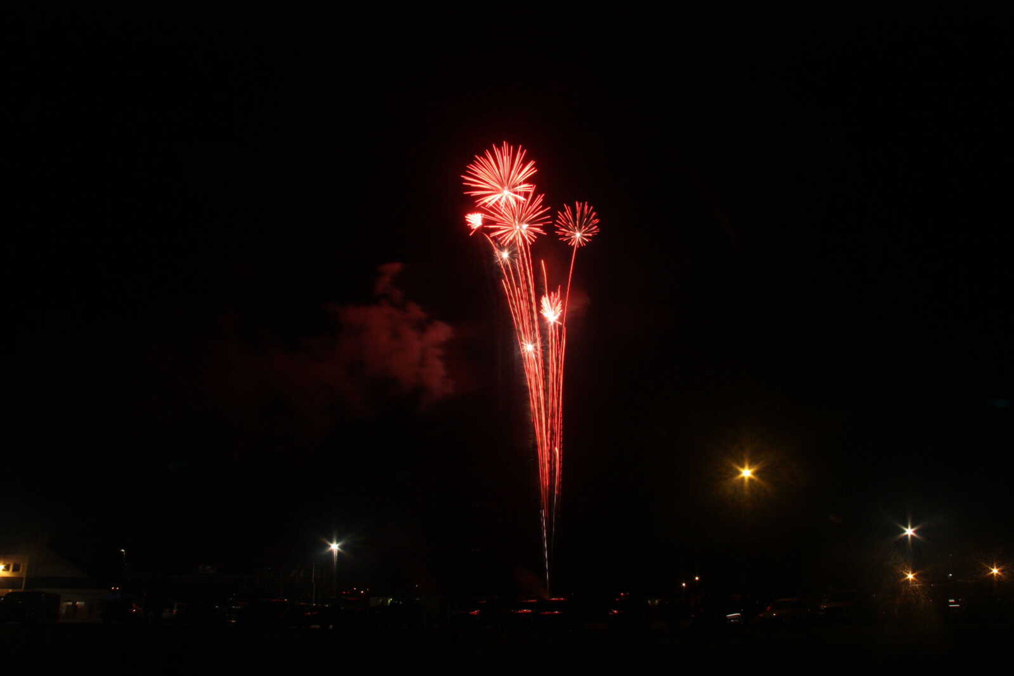 Picture of the fireworks display in Cape Girardeau's Arena Park, taken from a field south of the park.