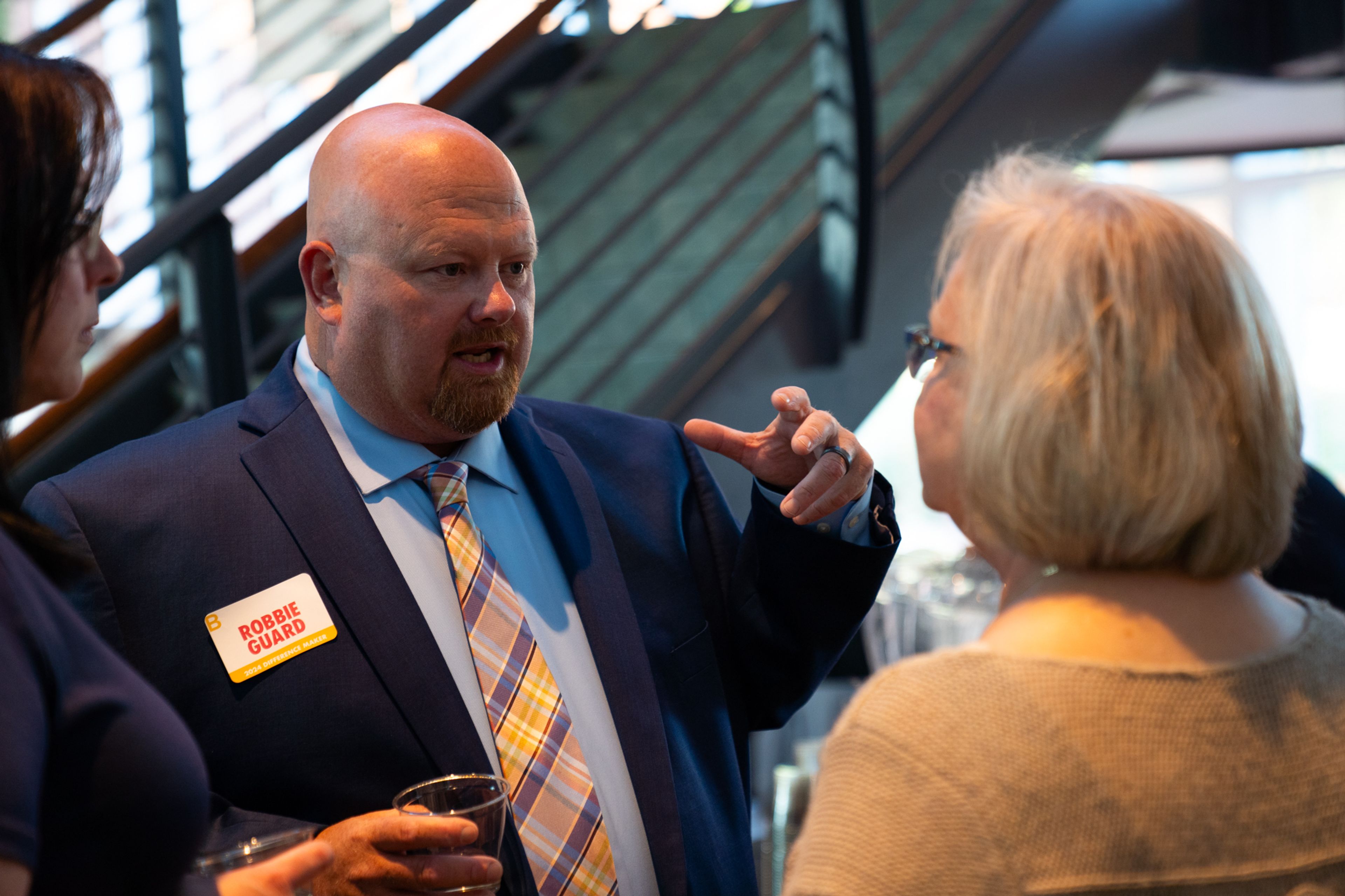 Difference Maker Robbie Guard speaks to other attendees while getting refreshments before the reception starts at 6 p.m.