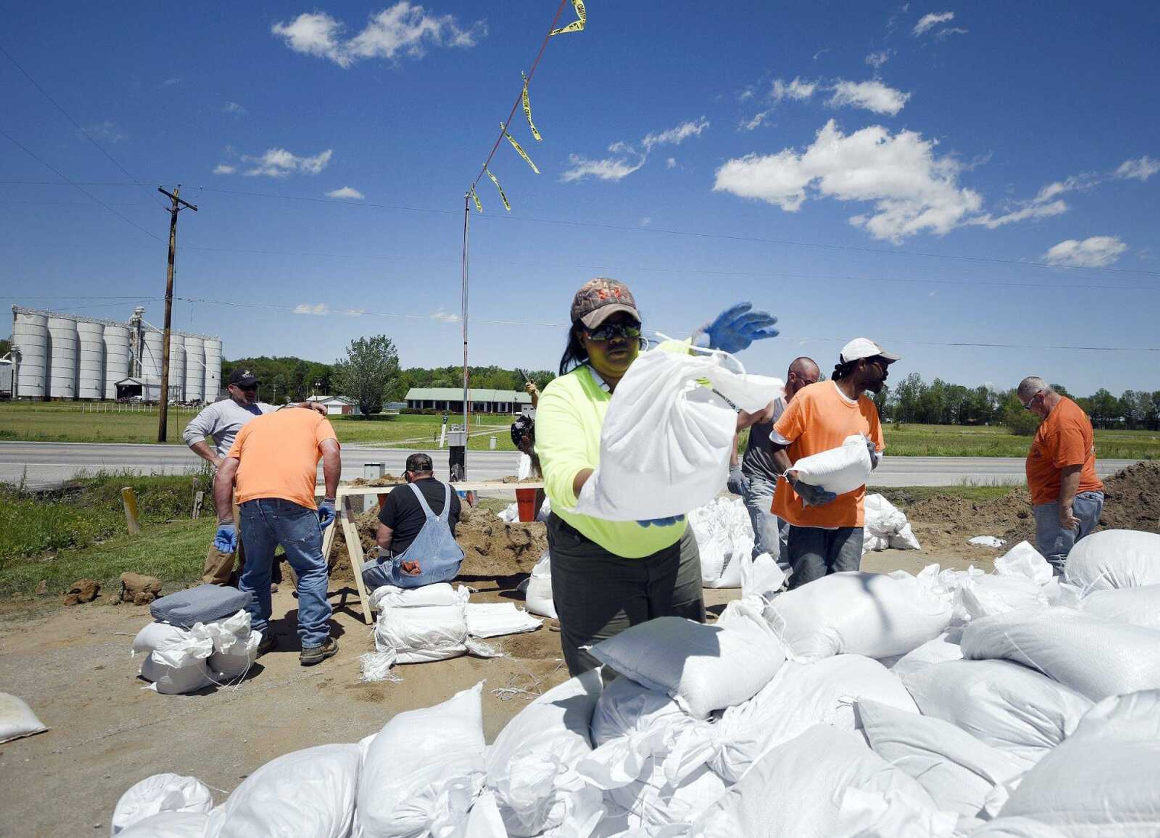 Machaela Durham helps sandbag Tuesday in Olive Branch, Illinois.