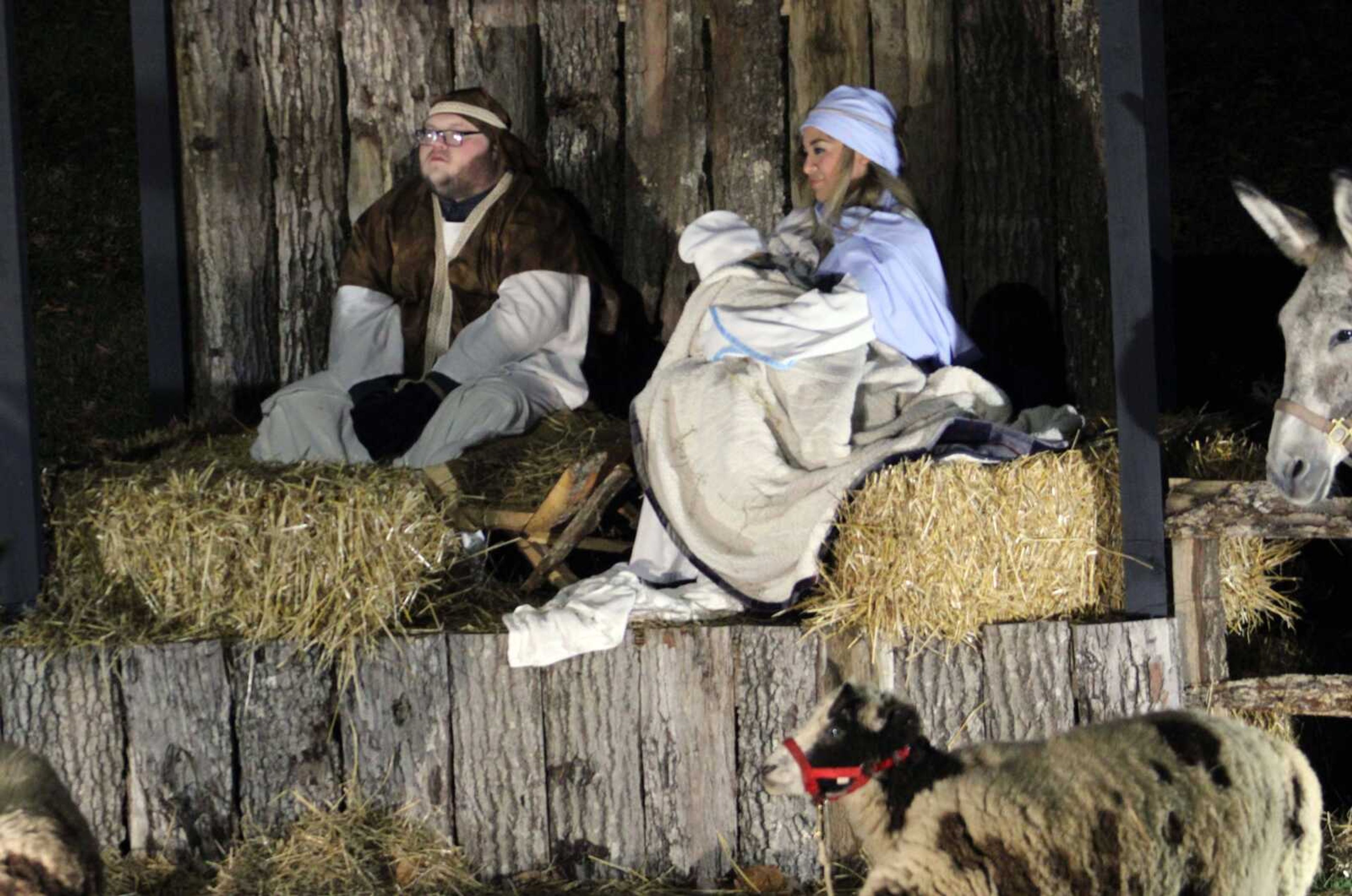 Volunteers dressed as Joseph, Mary and a live baby Jesus participate in the Live Nativity Scene created by Saint Francis Healthcare System in Cape Girardeau Saturday, Dec. 18, 2021.