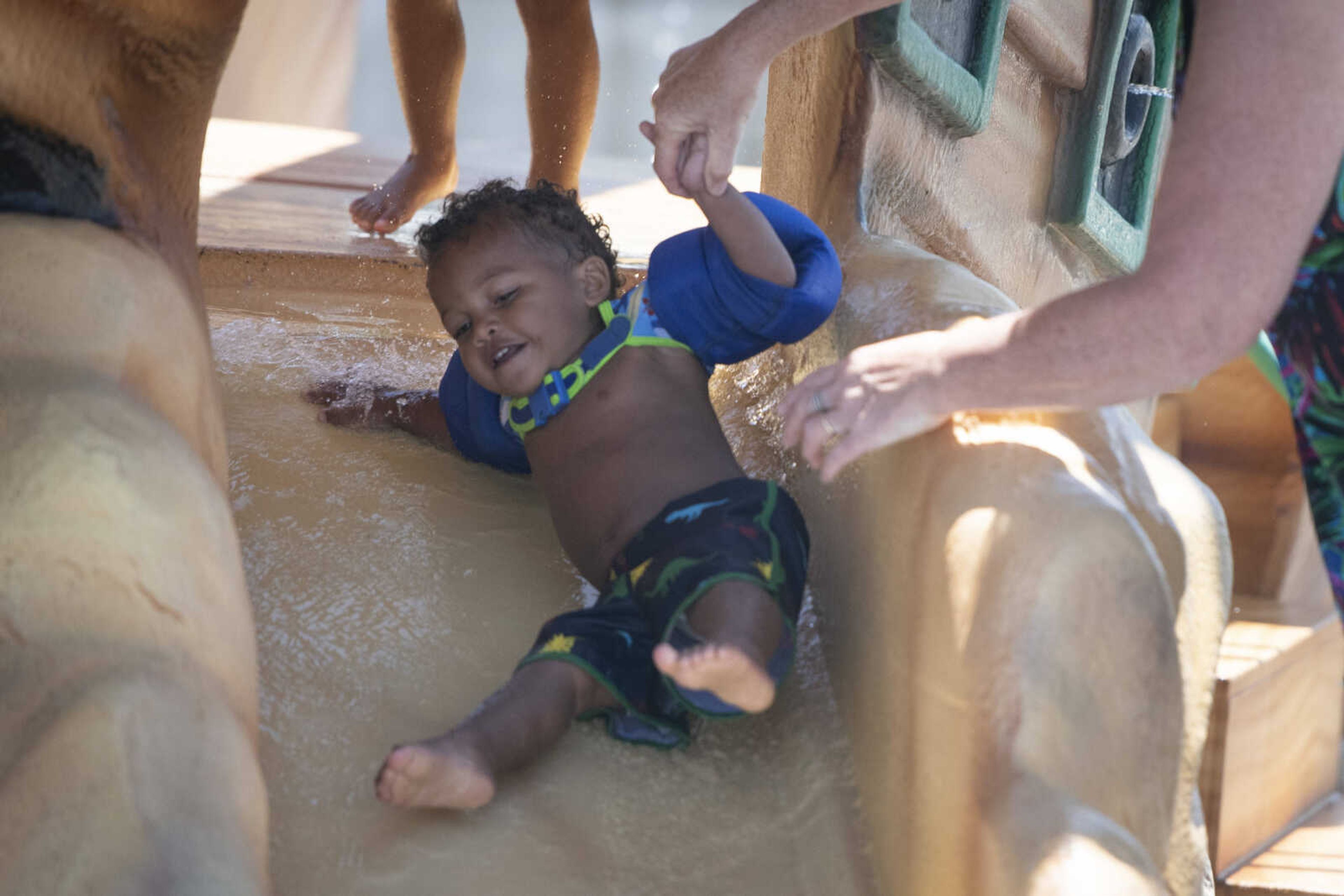 Charles Woodson Jr., 1, receives assistance from his grandmother Tammy Meyerhoff of Carbondale, Illinois, on Wednesday, June 10, 2020, at Cape Splash Family Aquatic Center in Cape Girardeau.