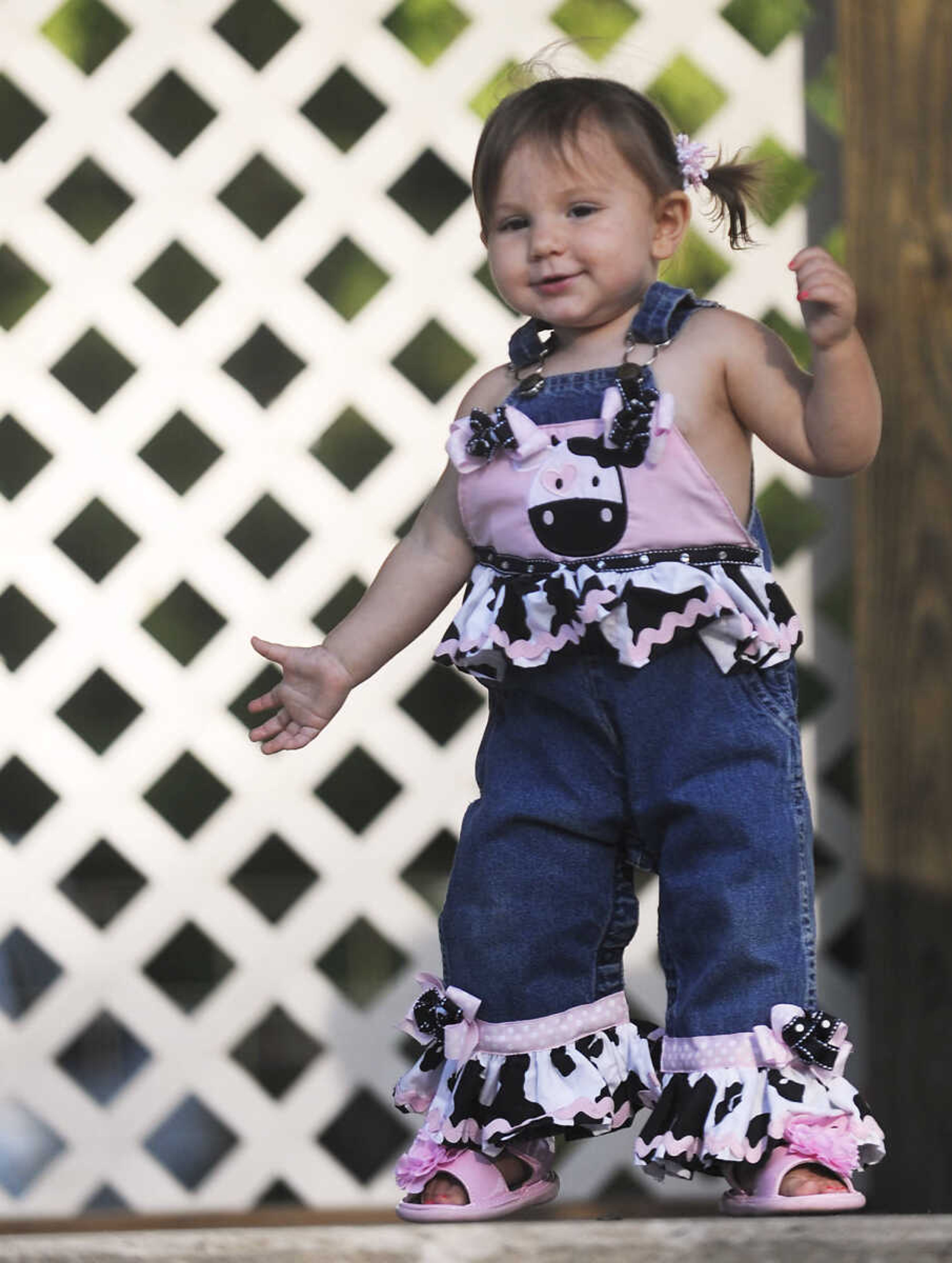 Liza Dohogne, 14 months, walks across the stage during the Mini Miss German Days Pageant during Chaffee's Annual German Days Festival Friday, August 10, at Frisco Park.