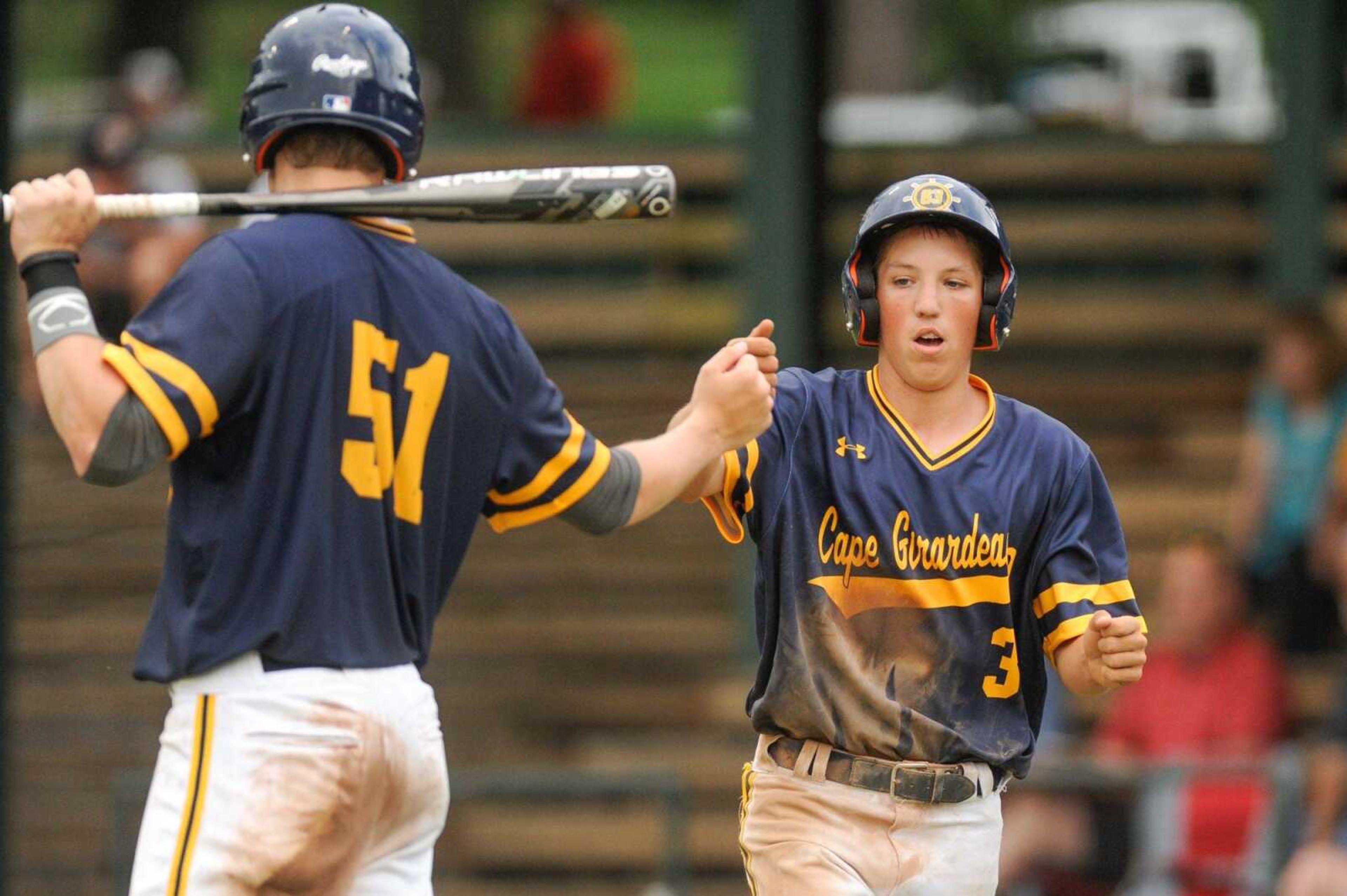 Cape Ford and Sons Post 63 Senior Legion's Matt Chism, left, congratulates Brock Baugher after scoring in the second inning against Sikeston Post 114 Senior Legion Wednesday, June 17, 2015 at Capaha Field. (Glenn Landberg)