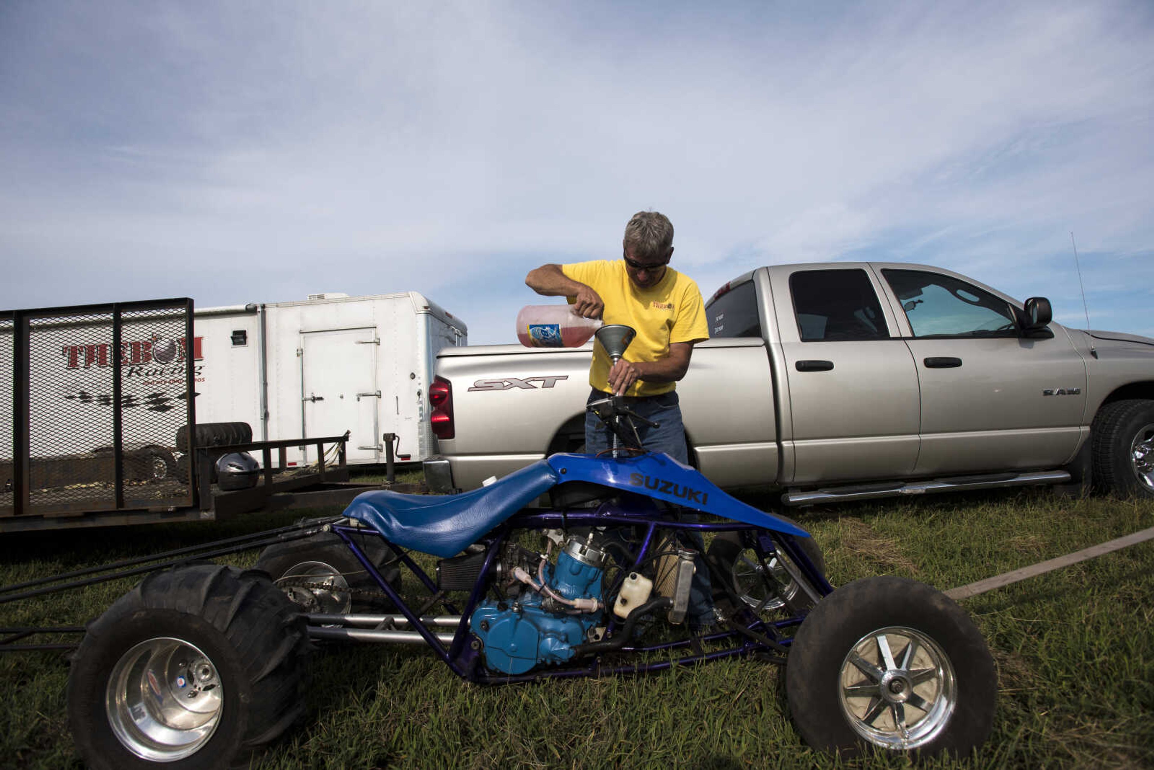 Faron Fowler fills up his ATV at the Missouri Dirt Motorsports Saturday, August 12, 2017 in Sikeston.