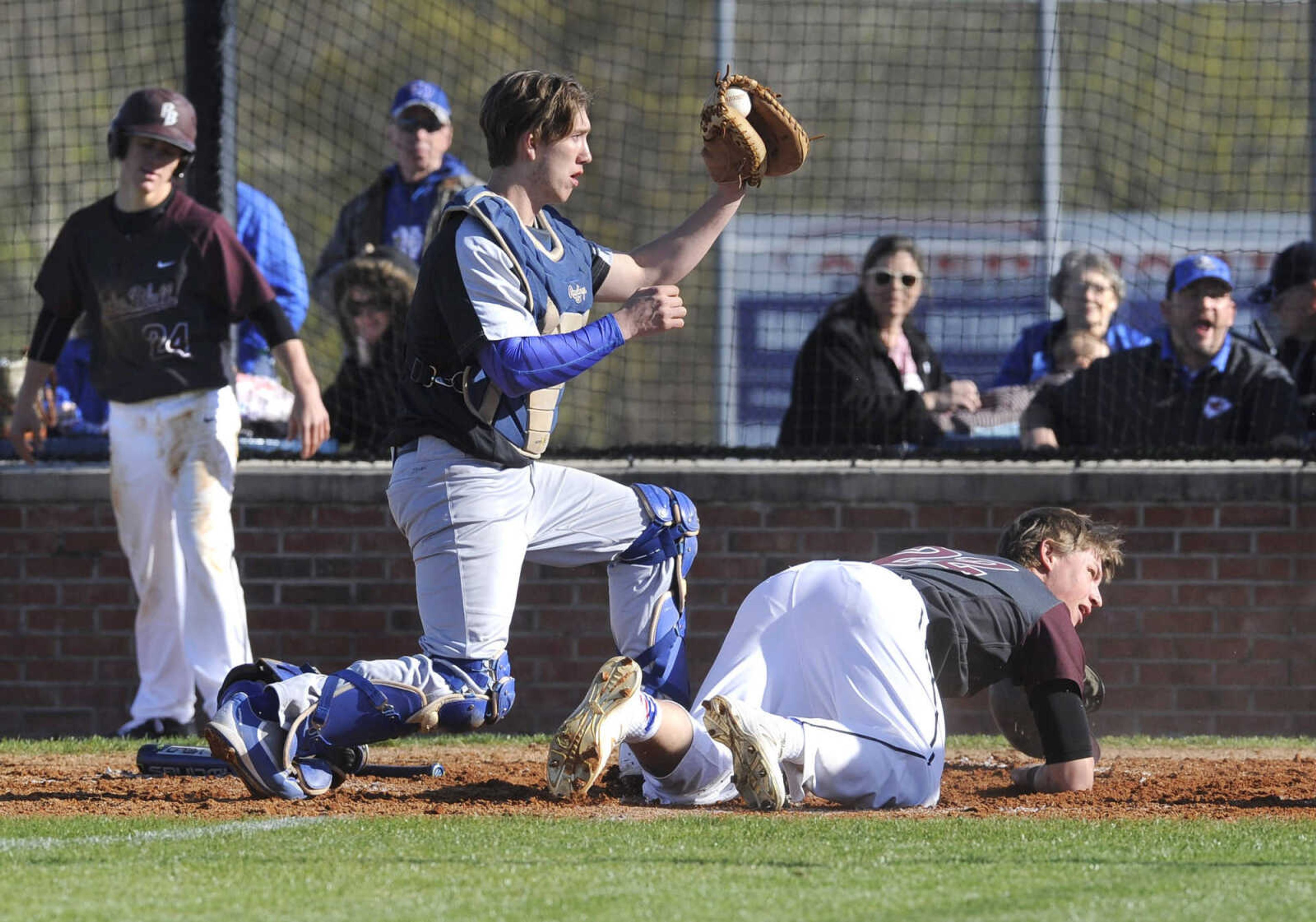 FRED LYNCH ~ flynch@semissourian.com
Notre Dame catcher Trevor Haas looks for the call after tagging Poplar Bluff's Joe Darlin, who the umpire called out on the play, during the third inning Tuesday, April 12, 2016 at Notre Dame Regional High School.