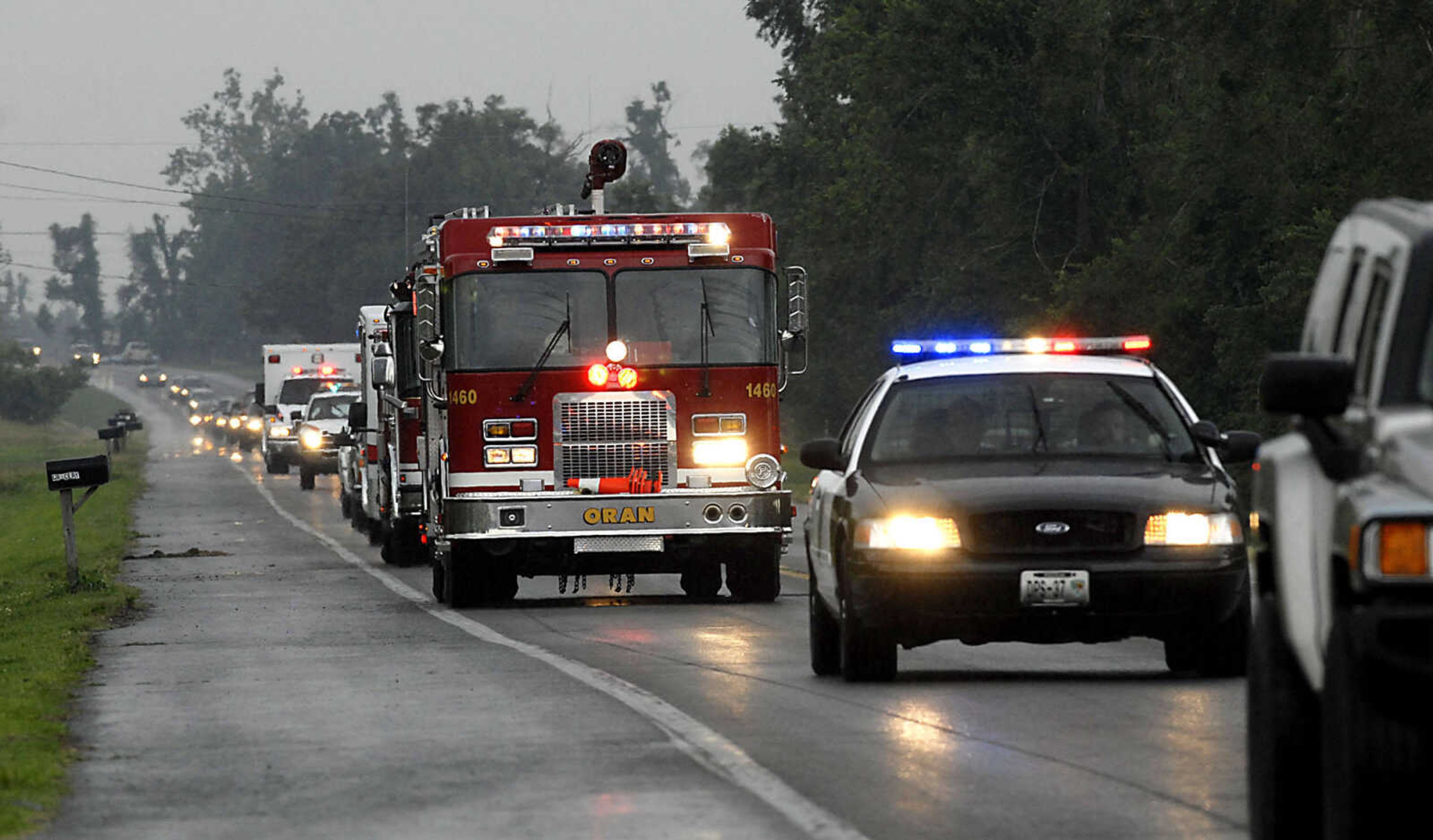 Many emergency vehicles participate in the Alexis Cummins funeral procession going from Sikeston to Oran Wednesday, June 3, 2009.