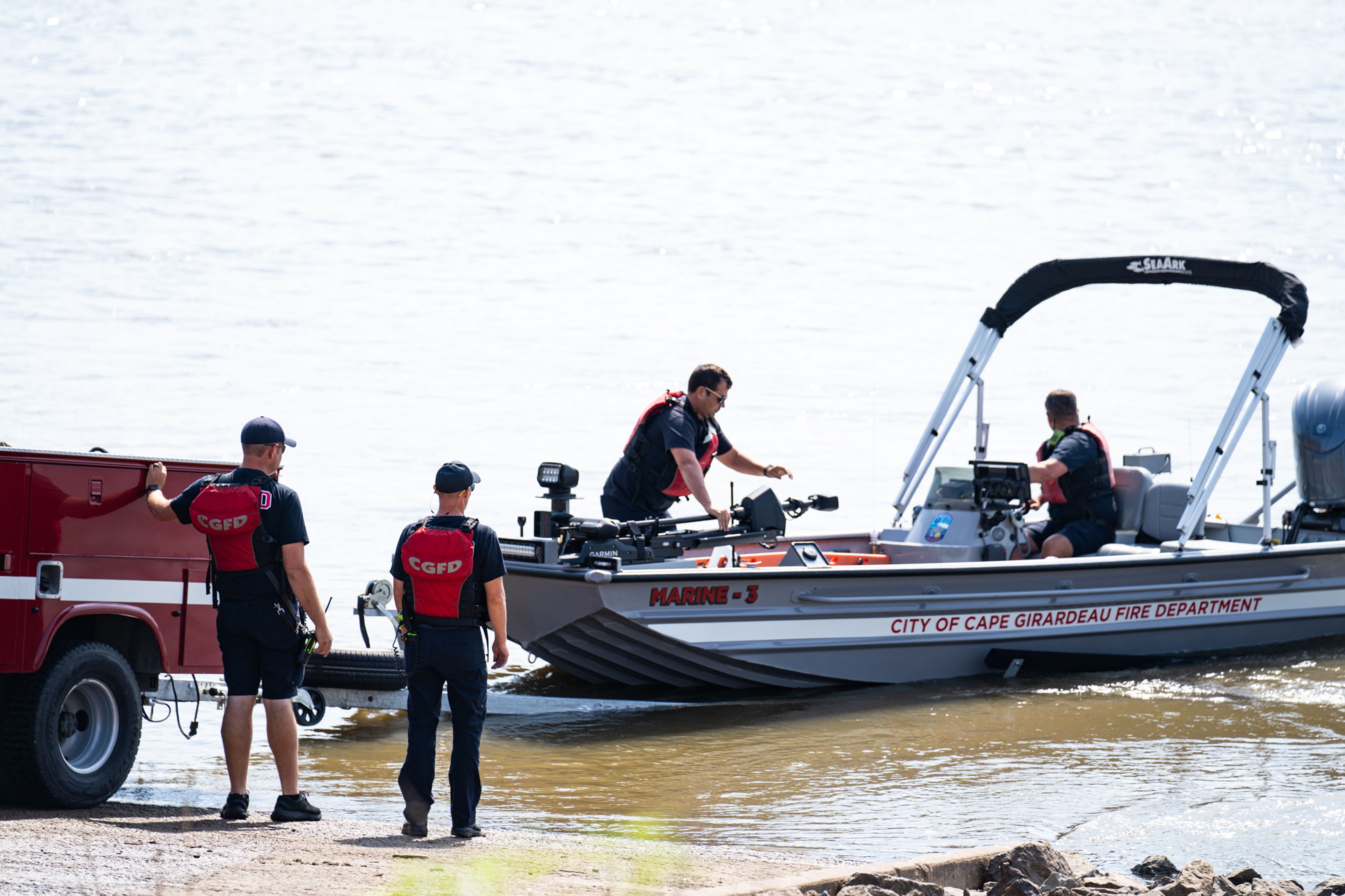 Cape Girardeau Fire Department personnel release a boat from the dock at the Red Star Access to rescue the two canoers who tumped over into the Mississippi River on Friday, Aug. 23.