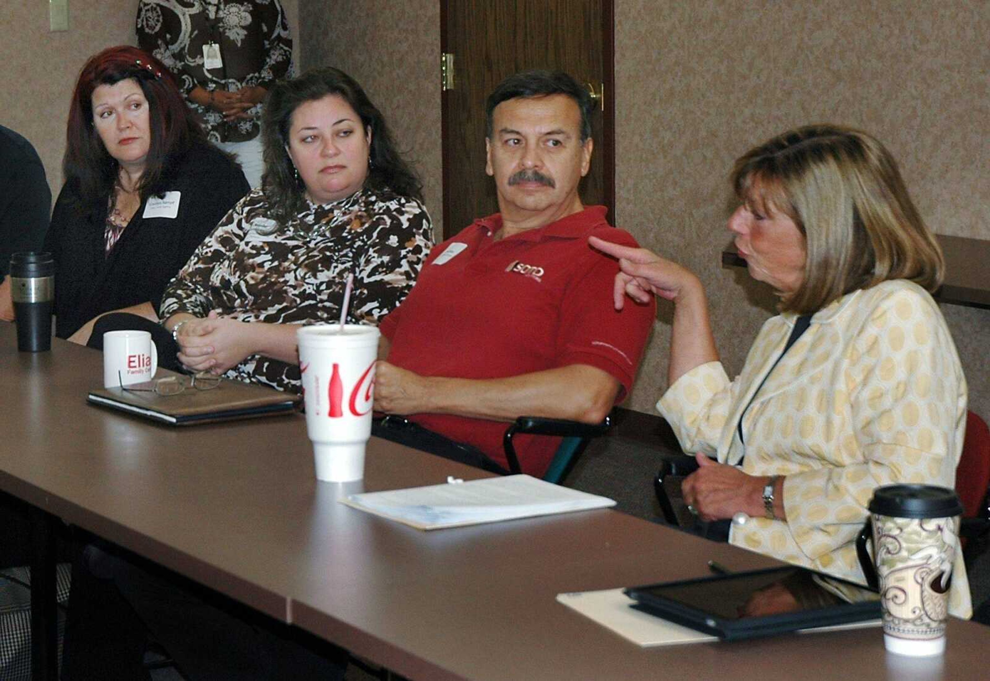 U.S. Rep. Jo Ann Emerson, far right, talked with local bankers, realtors and small business owners on Friday, June 10, 2011, at the Cape Girardeau Area Chamber of Commerce to get their input on how federal regulations are affecting them. From left are Carolyn Kempf, owner of Elite Travel, Jennifer Hendrickson, owner of Hendrickson Business Advisors and Murphy Business Brokerage, and David Soto, owner of Soto Property Solutions. (Melissa Miller)