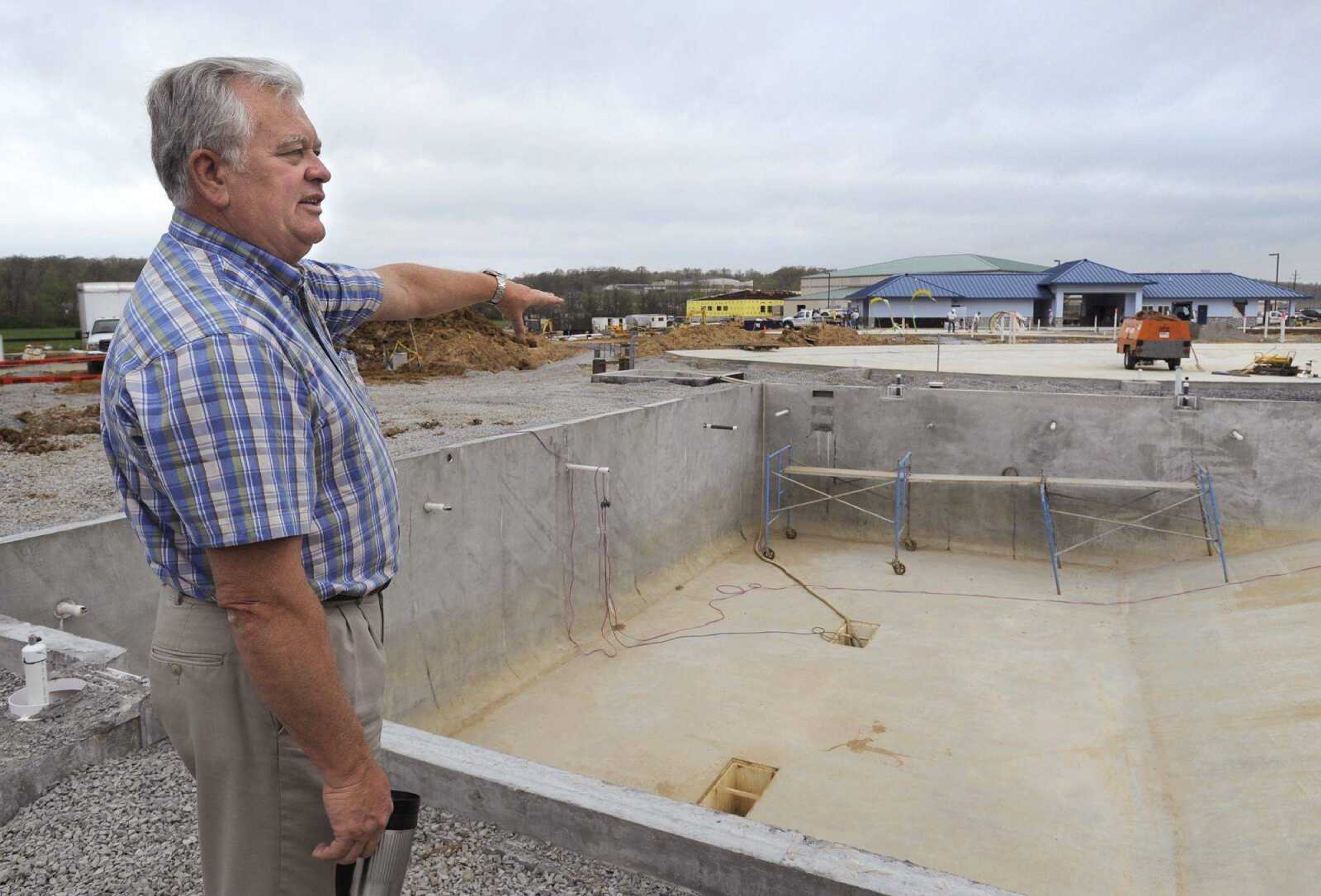 Dan Muser, director of the Cape Girardeau Parks and Recreation Department, shows the lap pool that is being constructed at the new water park behind the Osage Community Centre. (Fred Lynch)