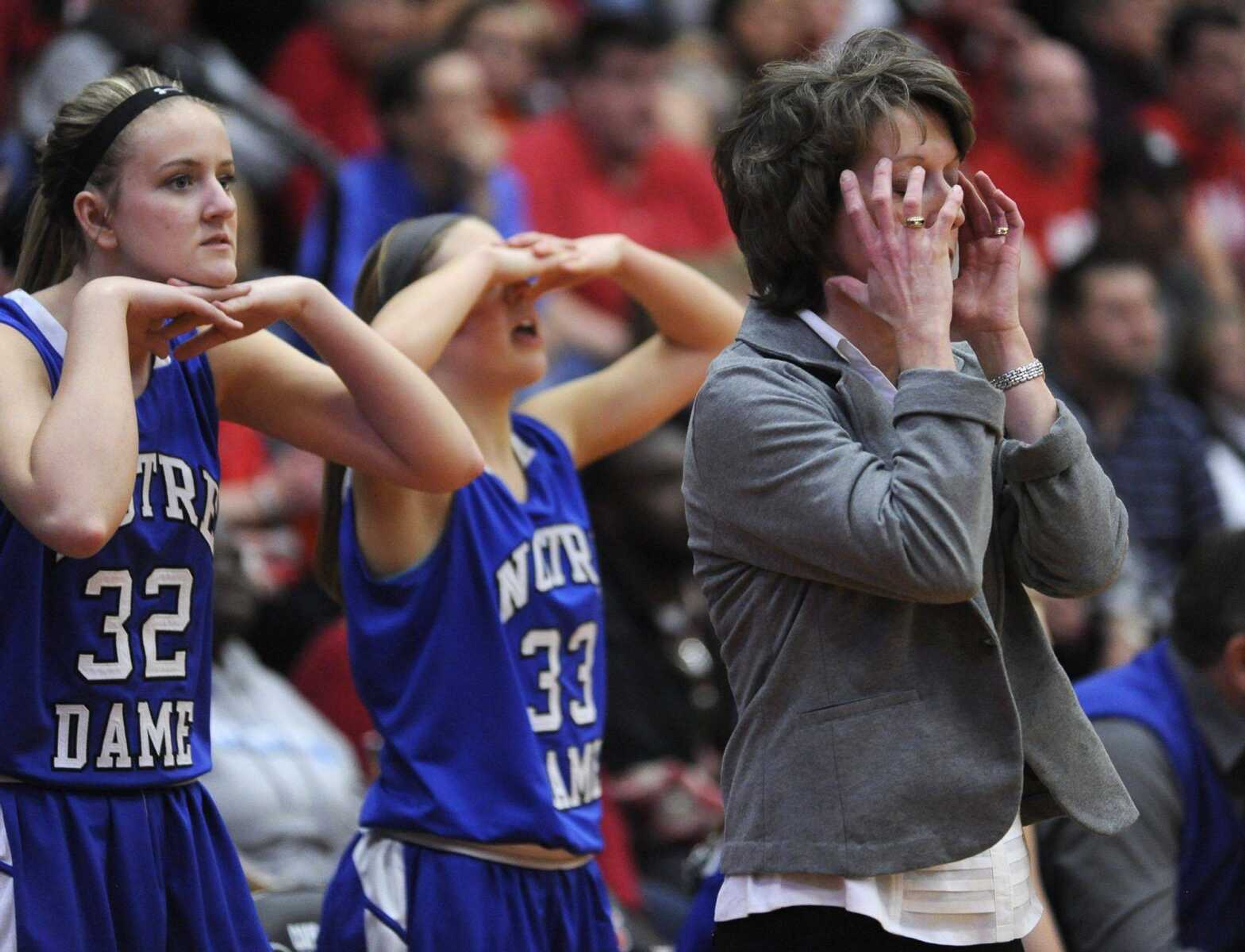 Notre Dame coach Renee Peters reacts to a missed basket against Dexter, with Abbie McAllister and Madeline Rosenquist, during the fourth quarter of the Class 4 District 1 championship game Friday at Central High School. More game photos can be viewed at semoball.com. (Fred Lynch)