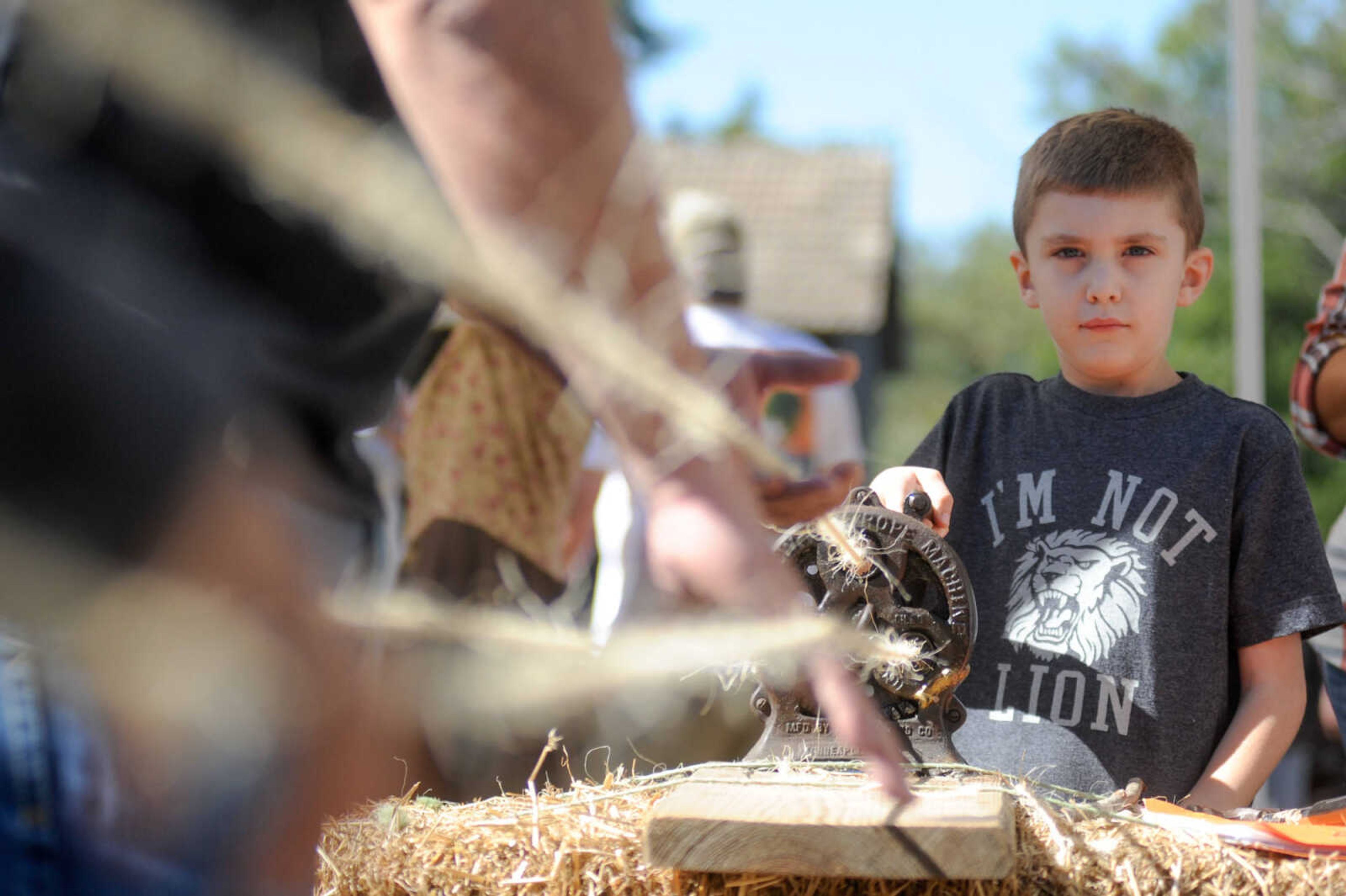 GLENN LANDBERG ~ glandberg@semissourian.com


Austin Avers cranks a handle to make a section of sisal twine rope during the Fall Festival at the Saxon Lutheran Memorial in Frohna, Missouri, Saturday, Oct. 10, 2015.