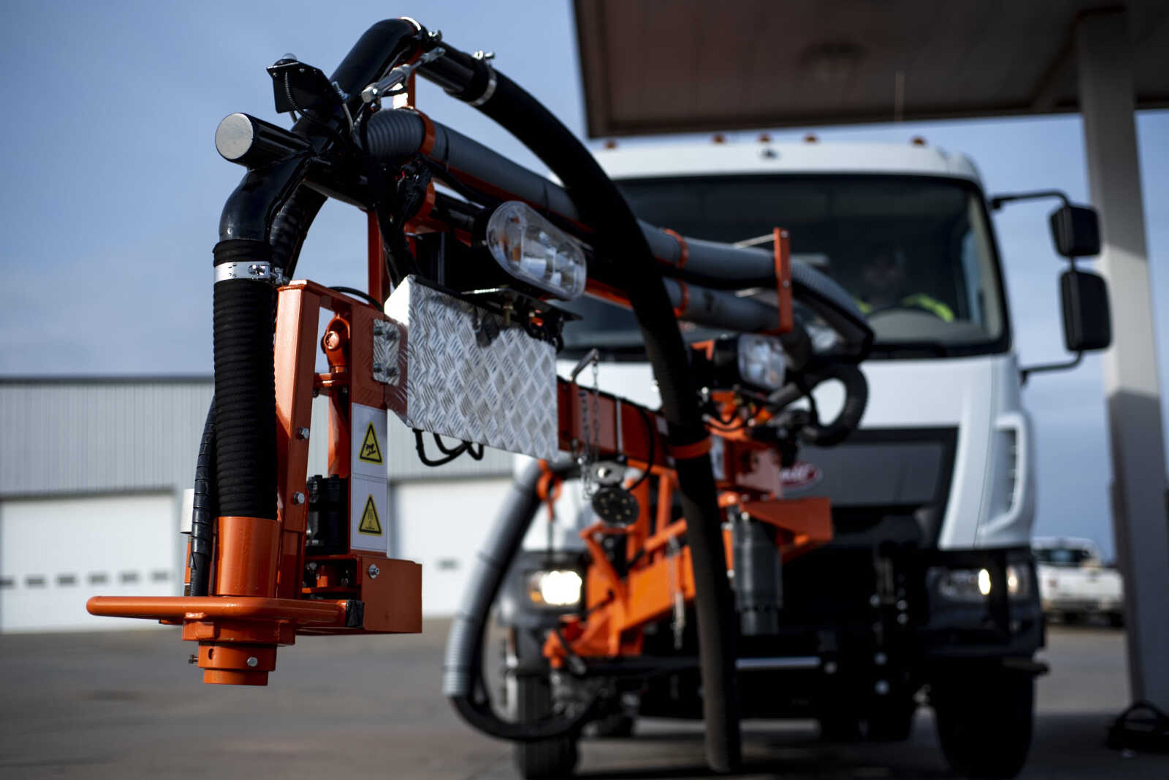 The arm of the new pothole-patching truck is extended through the control of Mitch Dacus, maintenance worker for the city of Cape Girardeau, while at the Cape Girardeau Public Works location Thursday, Jan. 31, 2019, in Cape Girardeau.