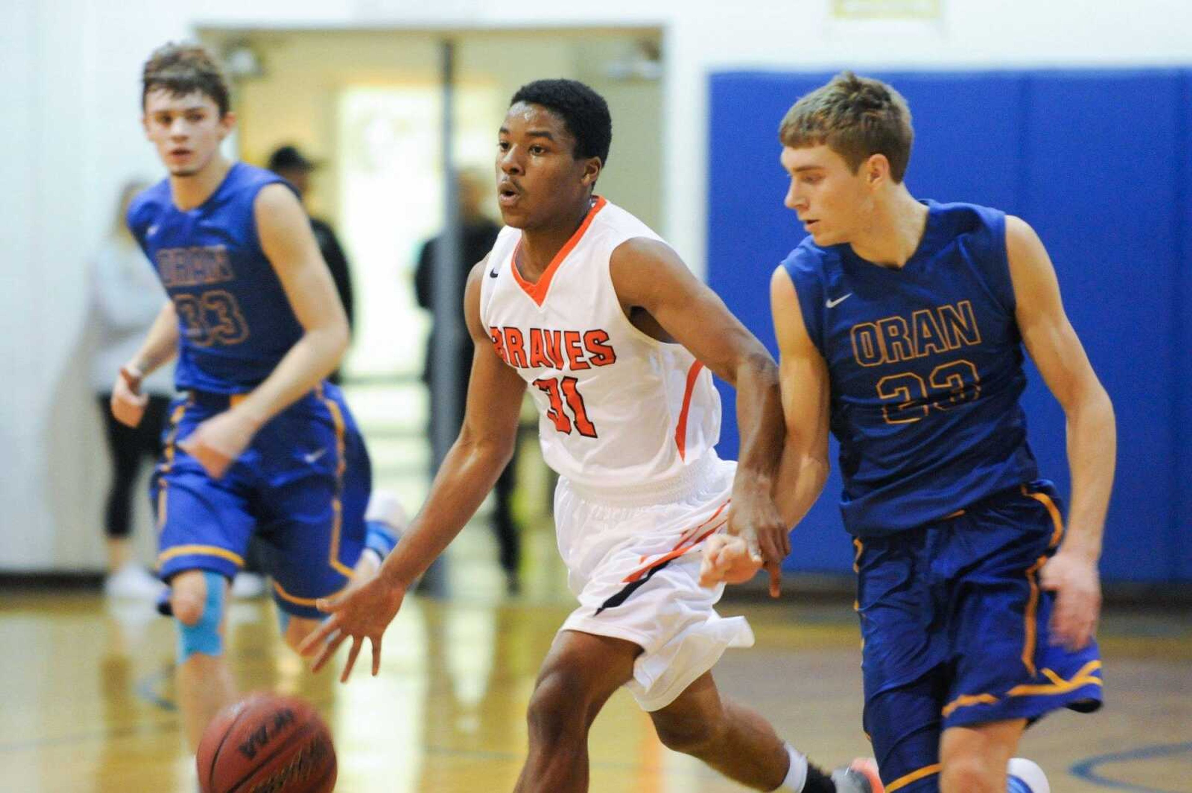 Scott County Central's Jeffery Porter drives down the court past Oran's Max Priggel during the second quarter of a semifinal game in the Scott-Mississippi Conference Tournament on Thursday, Jan. 21, 2016 in Scott City, Missouri.