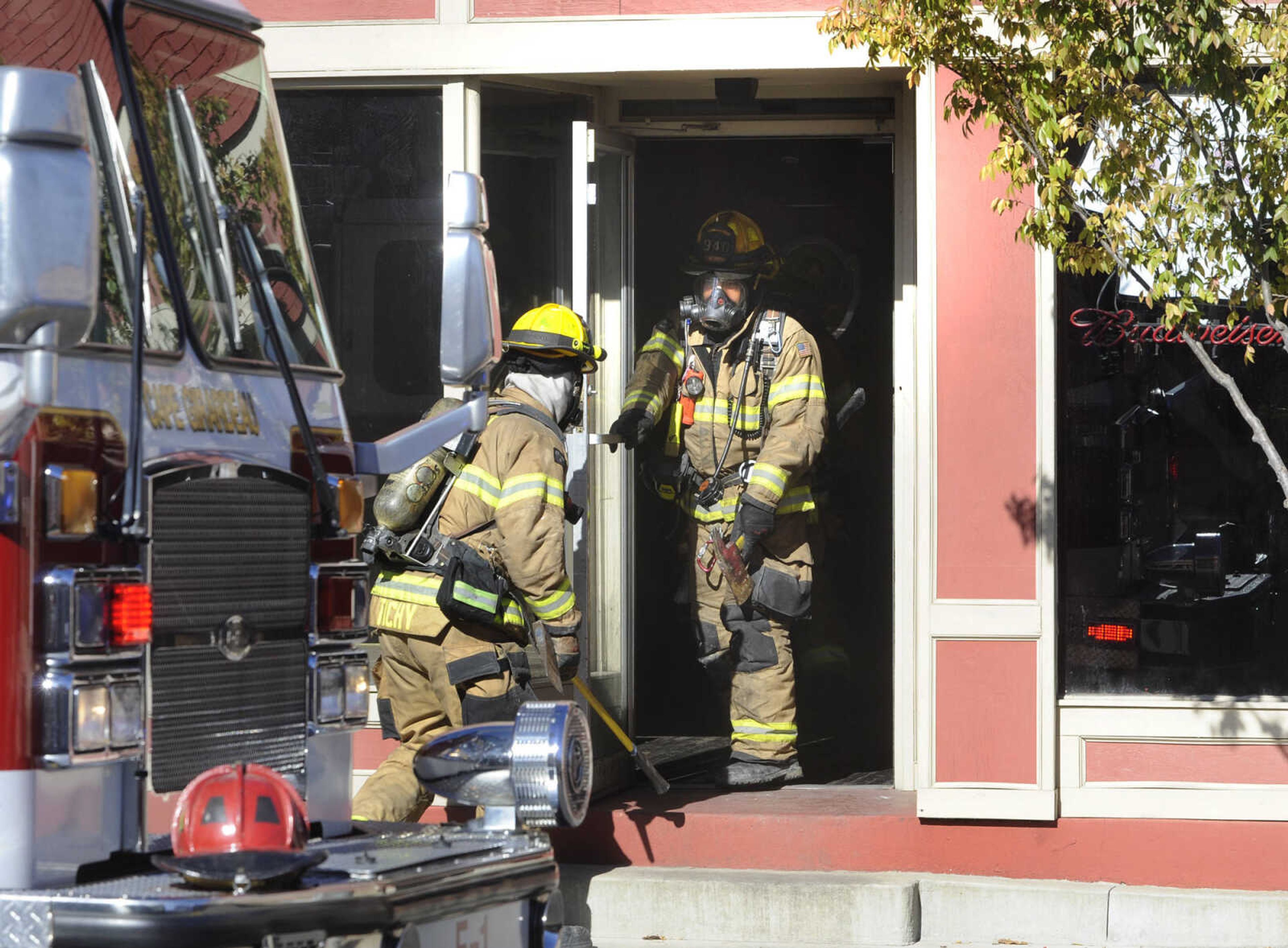 Cape Girardeau firefighters enter The Last Call at 632 Broadway Friday, Nov. 20, 2015 in Cape Girardeau. (Fred Lynch)