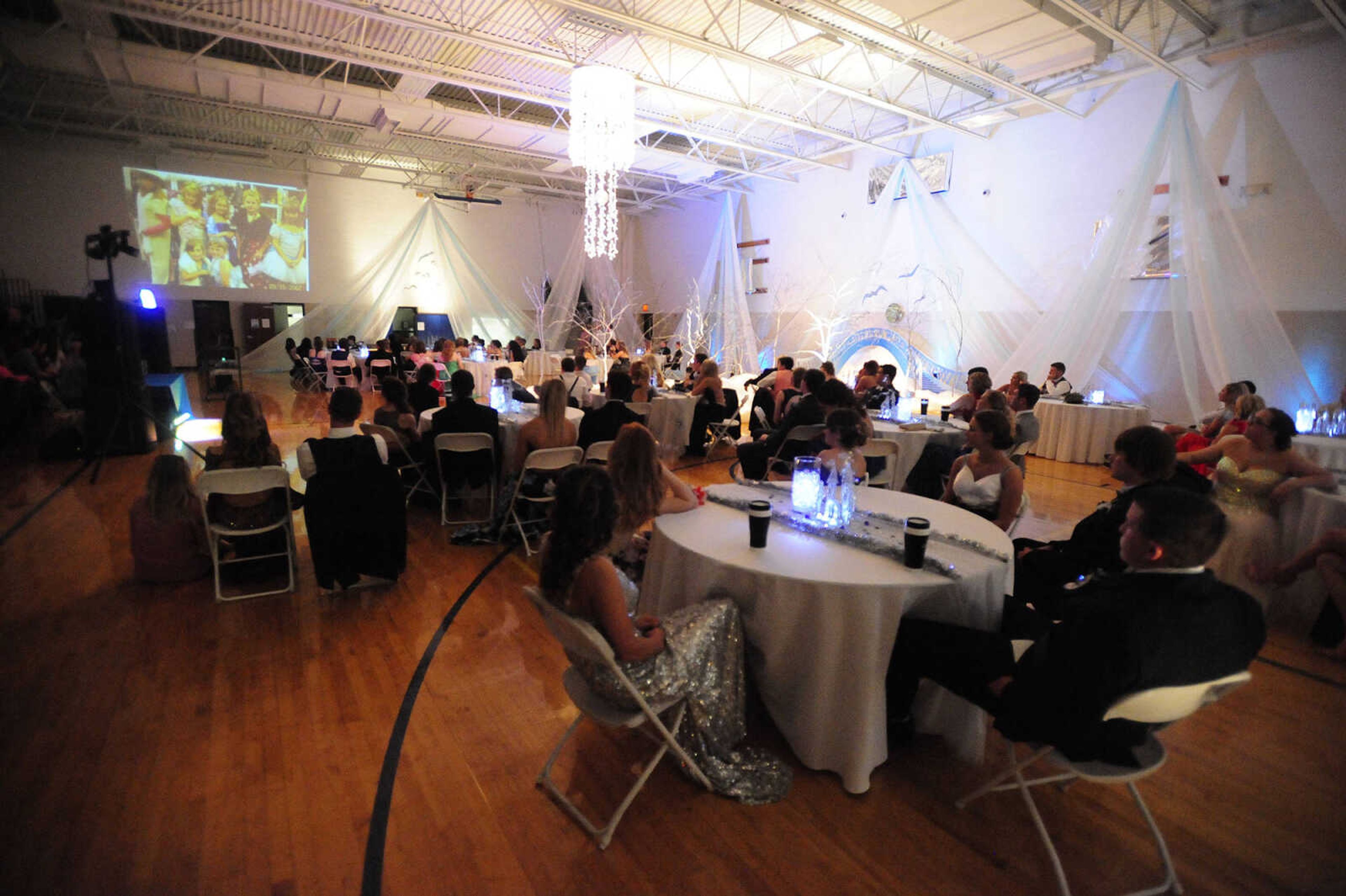 Oran students watch a video during their prom Saturday, April 8 at Oran High School.