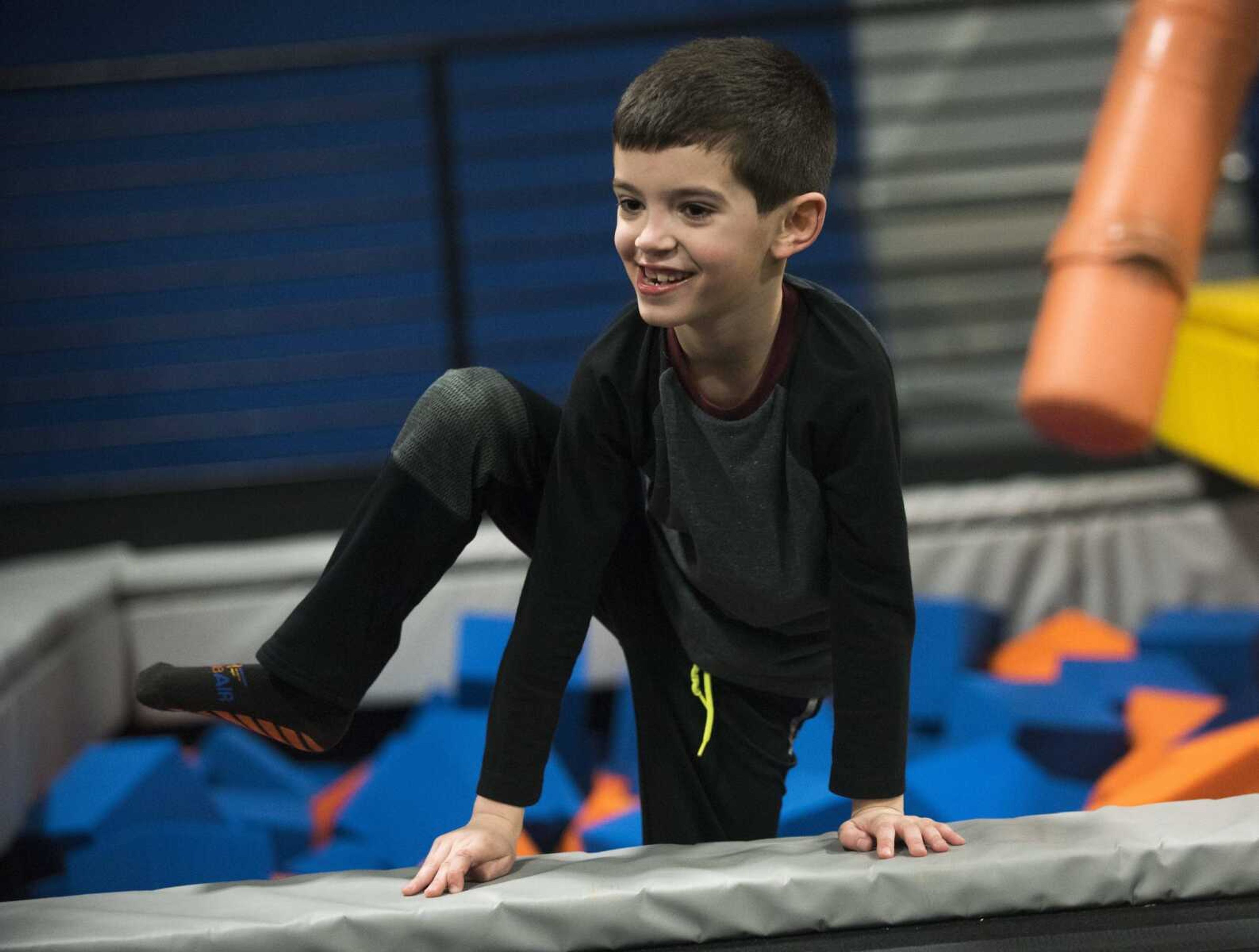 Emmett Griffin, 7, climbs out of a foam pit Tuesday, Feb. 13, 2018, during an Easterseals Midwest monthly outing at Ultimate Air Trampoline Park in Scott City.