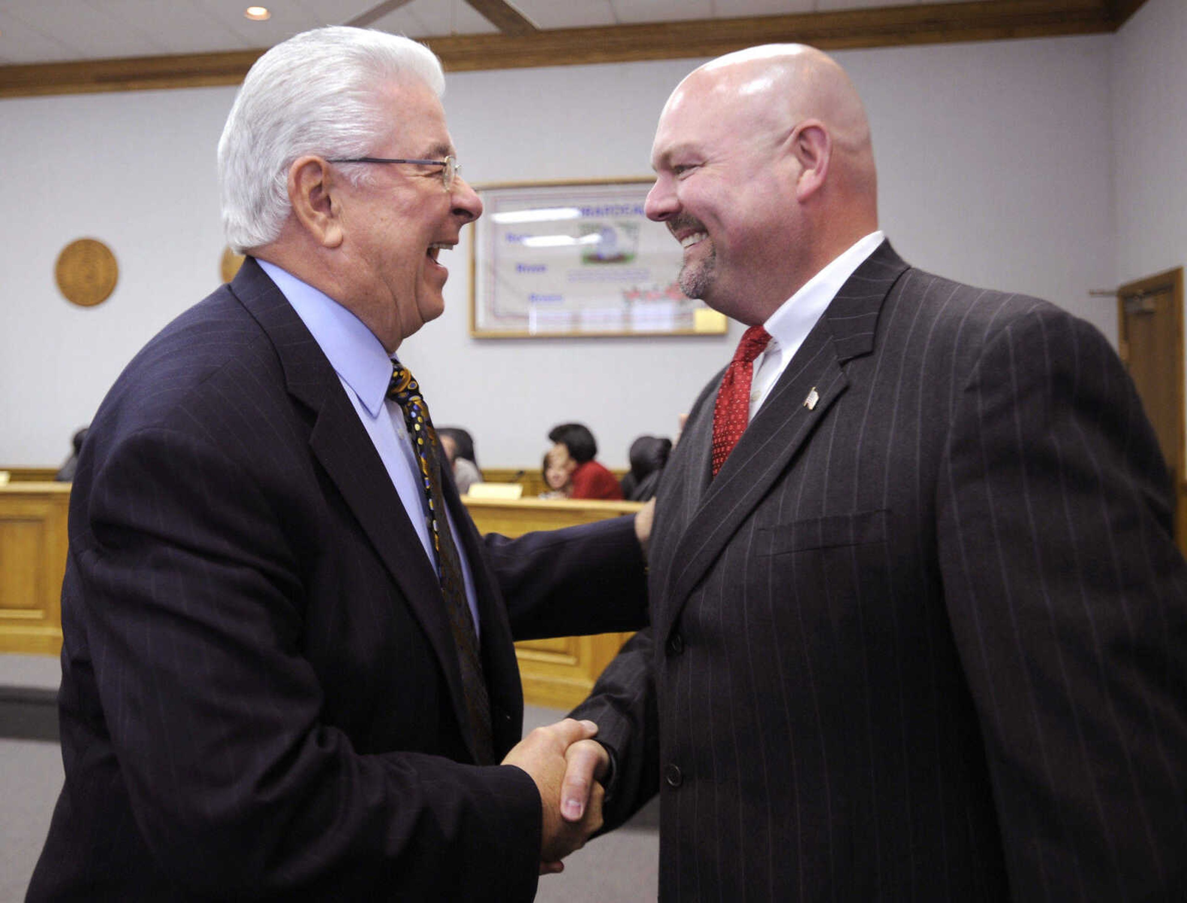 FRED LYNCH ~ flynch@semissourian.com
Harry Rediger, left, is greeted by Mayor Jay Knudtson prior to Rediger being sworn in as the new mayor of Cape Girardeau on April 9, 2010 at city hall.