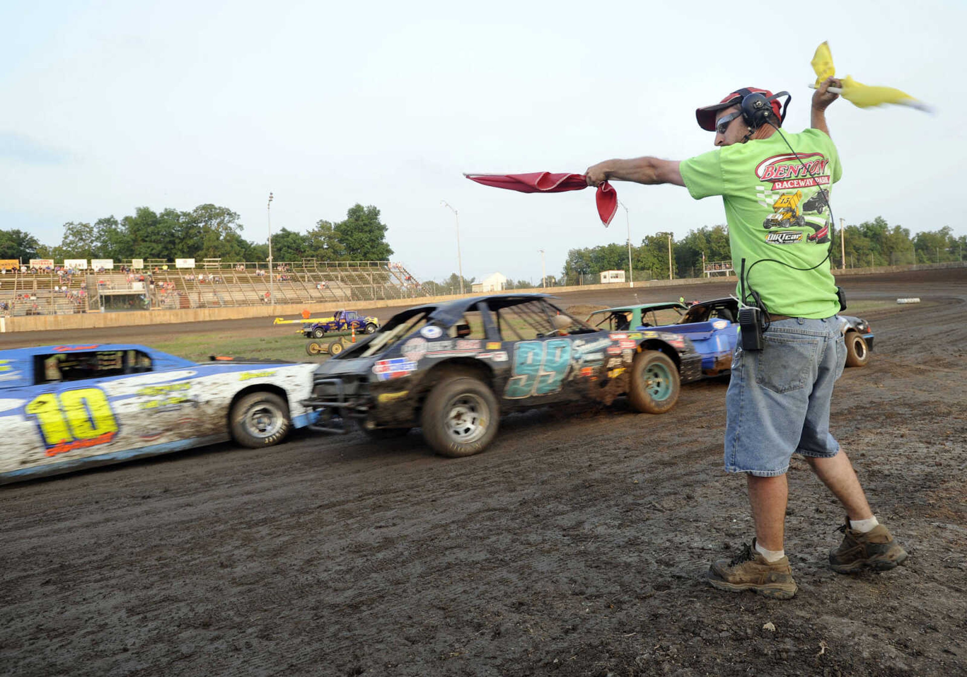 FRED LYNCH ~ flynch@semissourian.com
Derek DeSpain gives drivers the "ready to go" signal for a race at Benton Raceway Park Saturday, May 18, 2013.