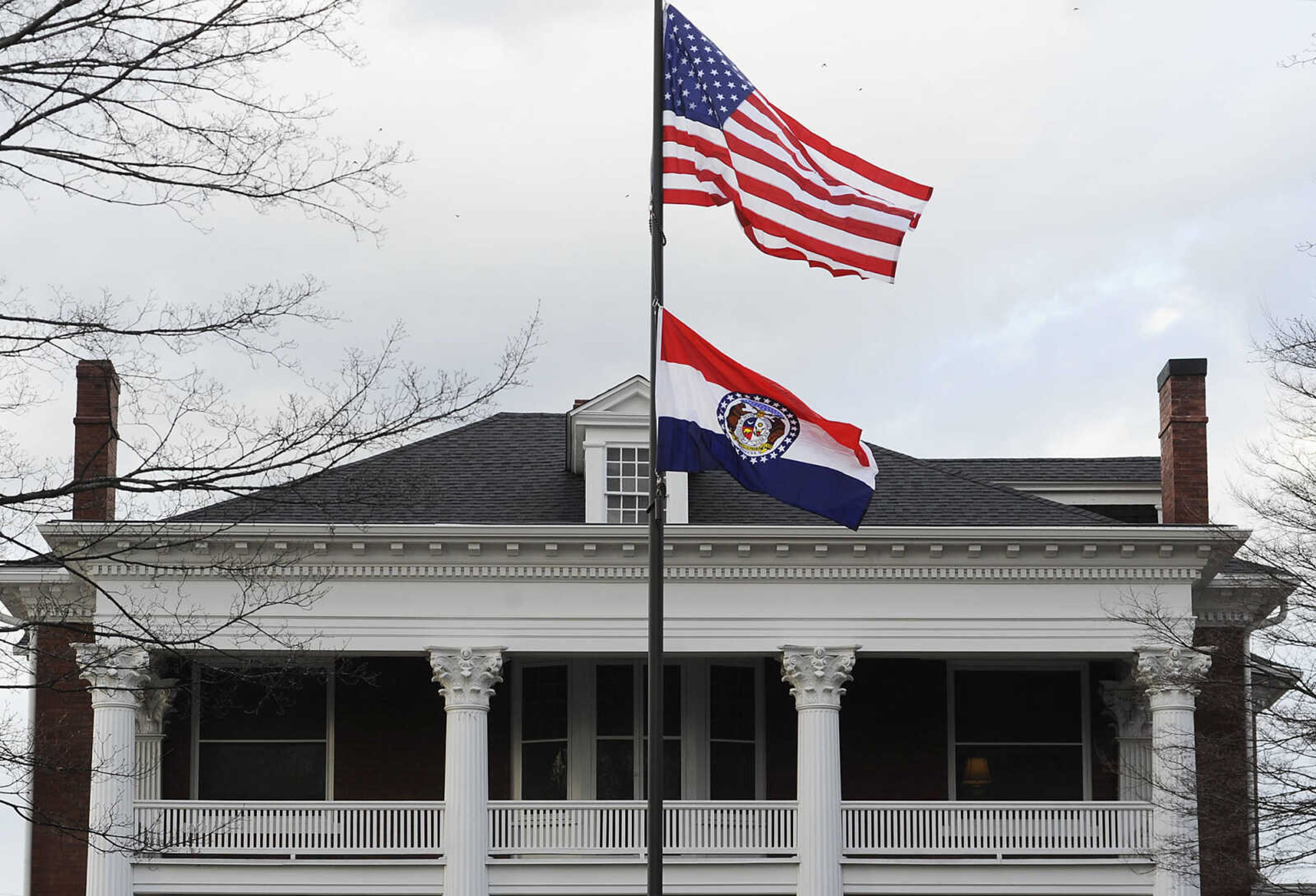 ADAM VOGLER ~ avogler@semissourian.com
The Missouri state flag flies, Tuesday, March 12, outside of the  Oliver-Leming House, 740 North Street, in Cape Girardeau. The flag was designed in the house in 1913 by Marie Watkins Oliver, wife of state Senator R.B. Oliver. The home is now owned by Drs. Bert and Mary Ann Kellerman and will be featured in a three-day Missouri Flag Centennial Celebration scheduled for March 21 through March 23.