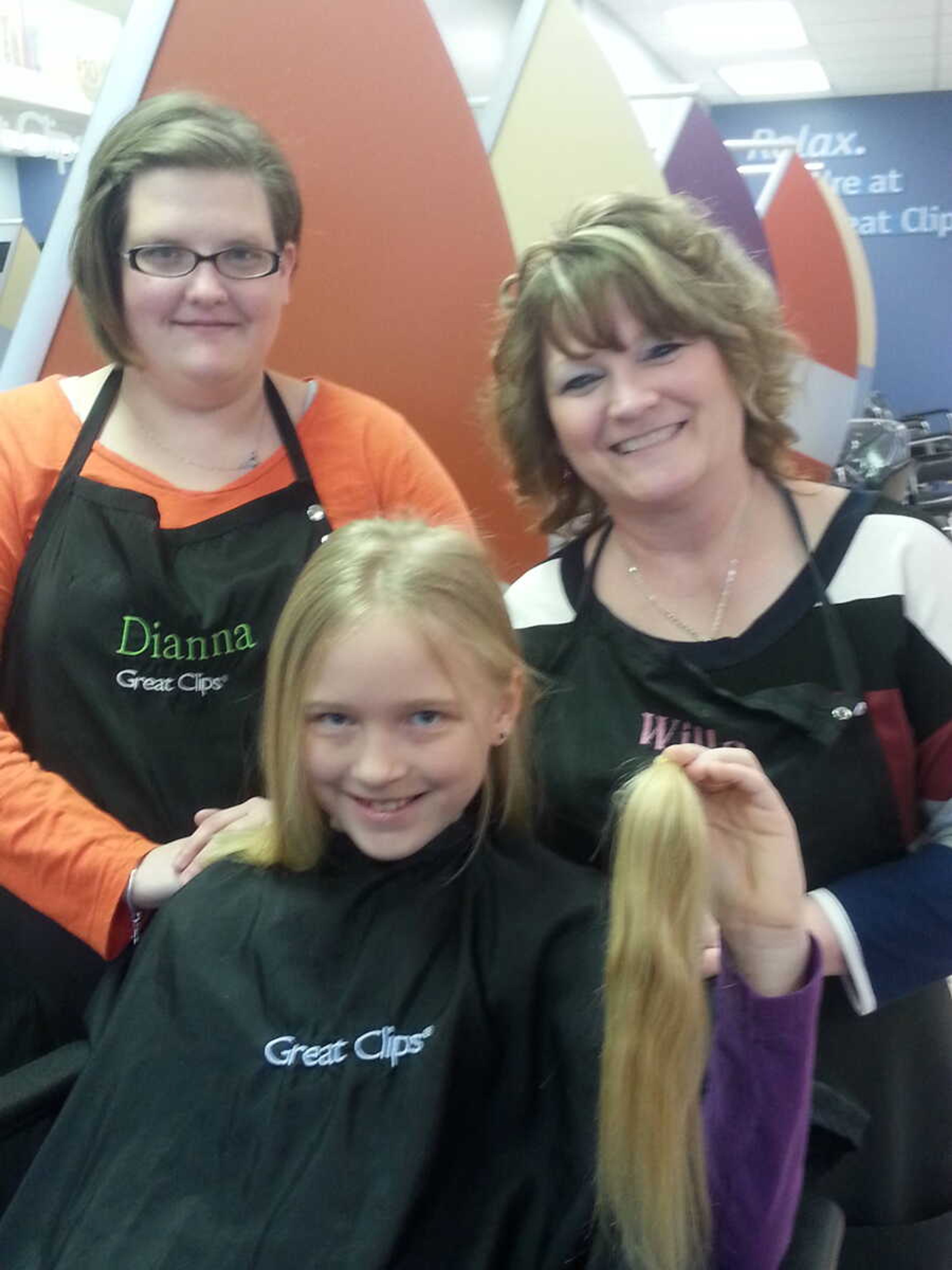 Pictured (from left): Dianna Worley, stylist at Great Clips; Alexa; and Willa Welter, manager at Great Clips.