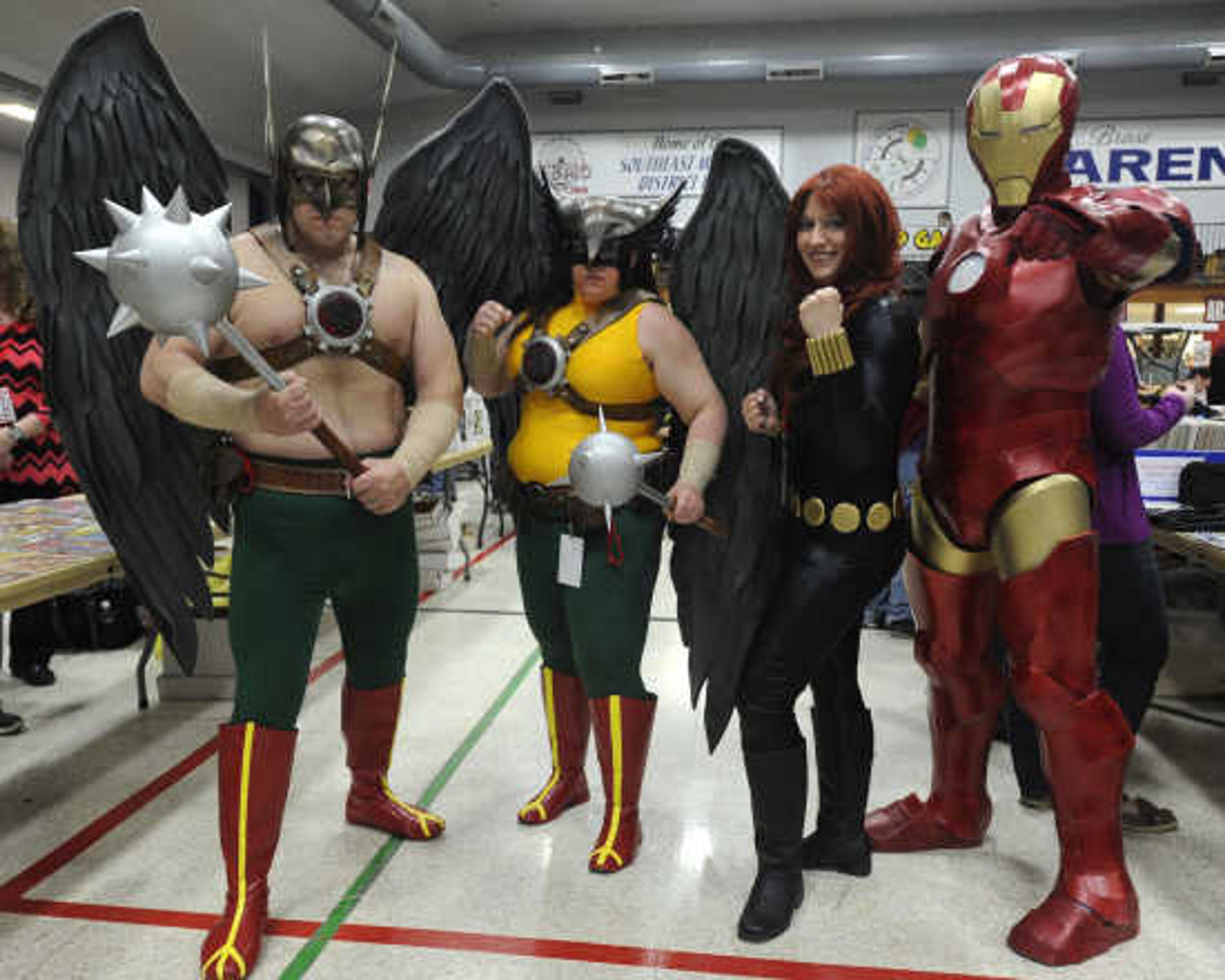 Santino Marani, left, as Hawkman, Tammy Marani as Hawkgirl, Ashley Bayles as Black Widow and Scott Bayles as Iron Man pose at Cape Comic Con on Saturday, March 22, 2014, at the Arena Building. 