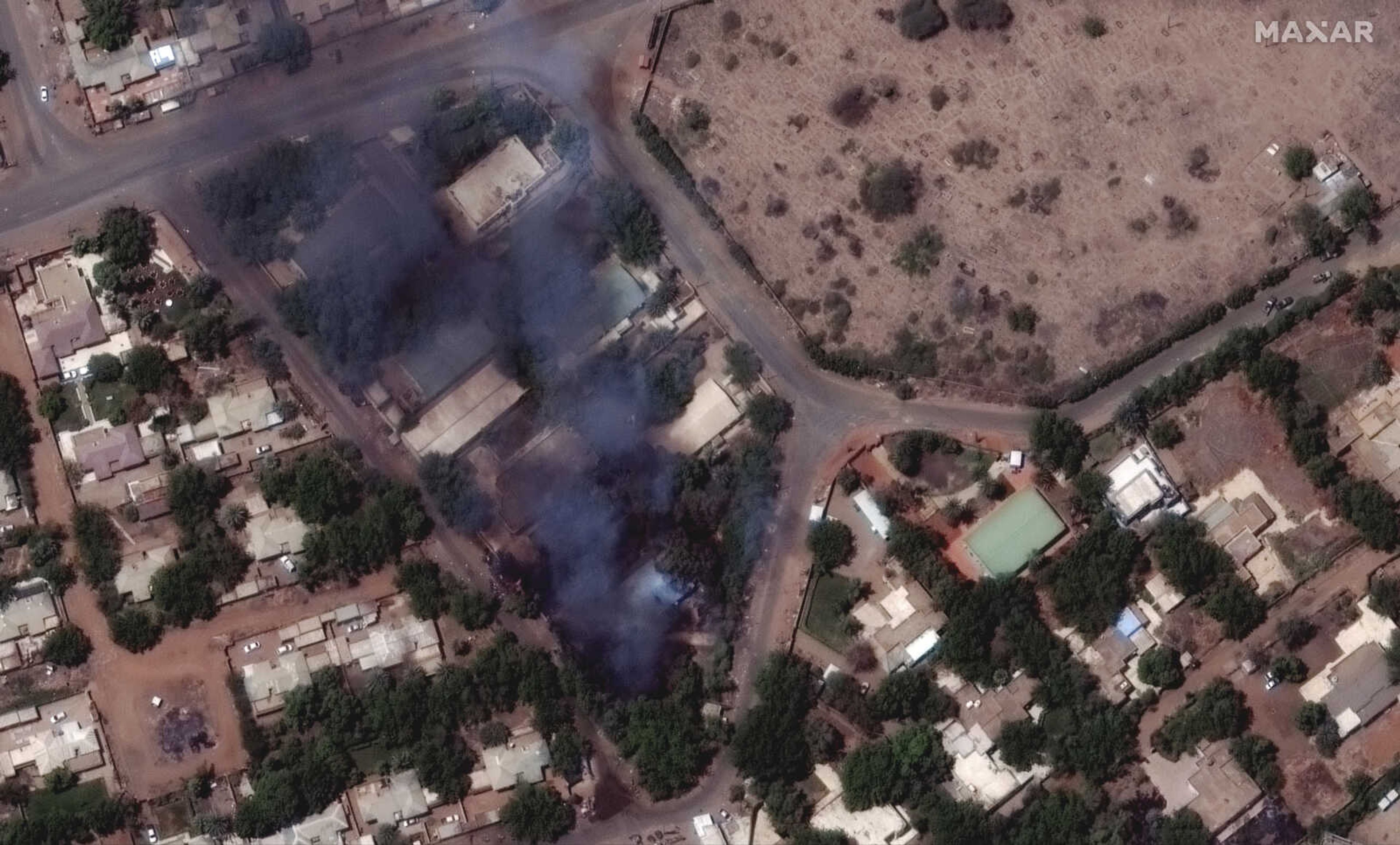 This satellite image provided by Maxar Technologies shows burning buildings and military patrol northeast of Khartoum International Airport, Sudan, Monday April 17, 2023. The Sudanese military and a powerful paramilitary group are battling for control of the chaos-stricken nation for a third day. (Satellite image Â©2023 Maxar Technologies via AP)