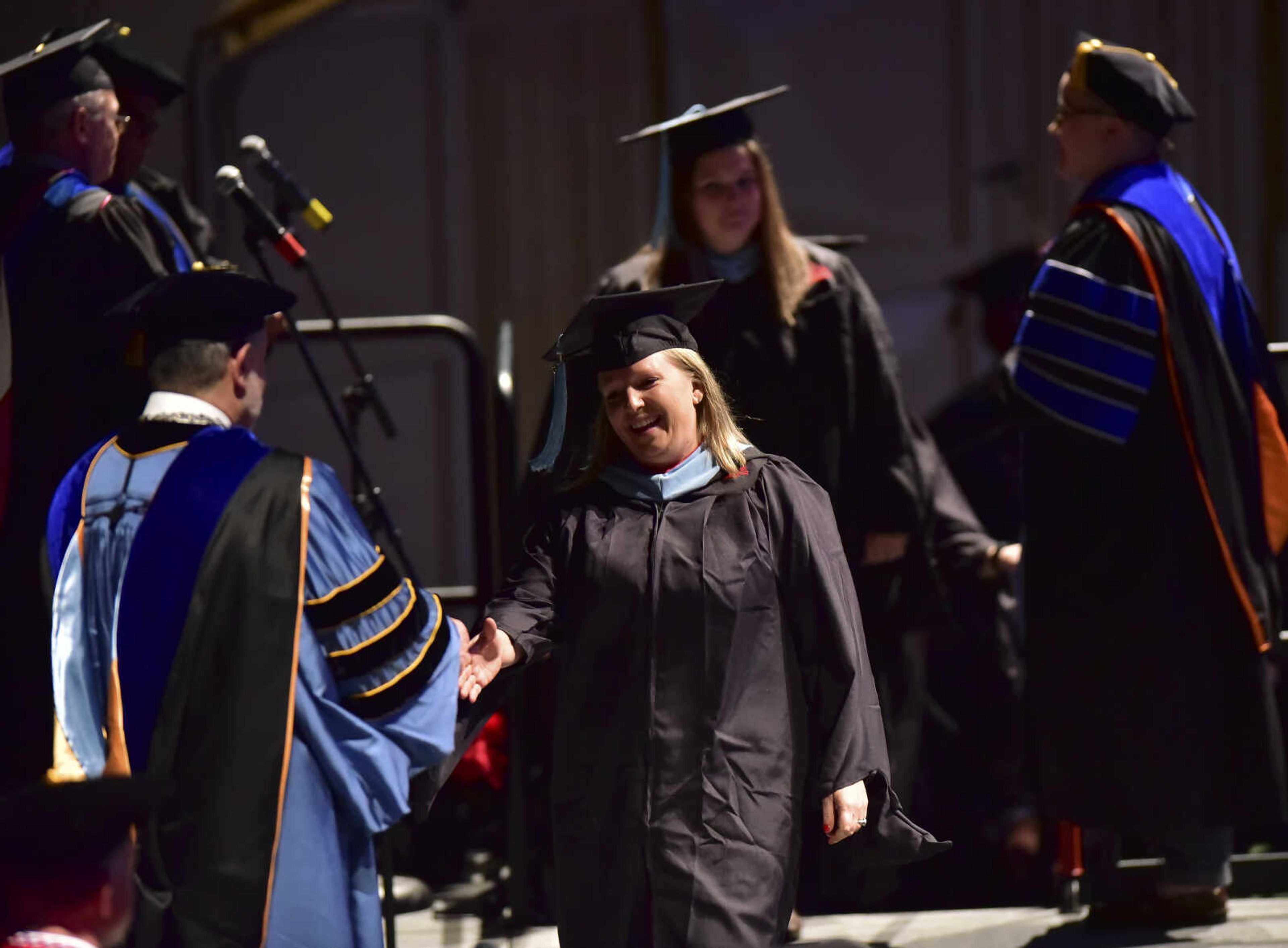 ANDREW J. WHITAKER ~ awhitaker@semissourian.com
Students walk on stage during Southeast Missouri State University graduation Saturday, Dec. 17, 2016 at the Show Me Center in Cape Girardeau.