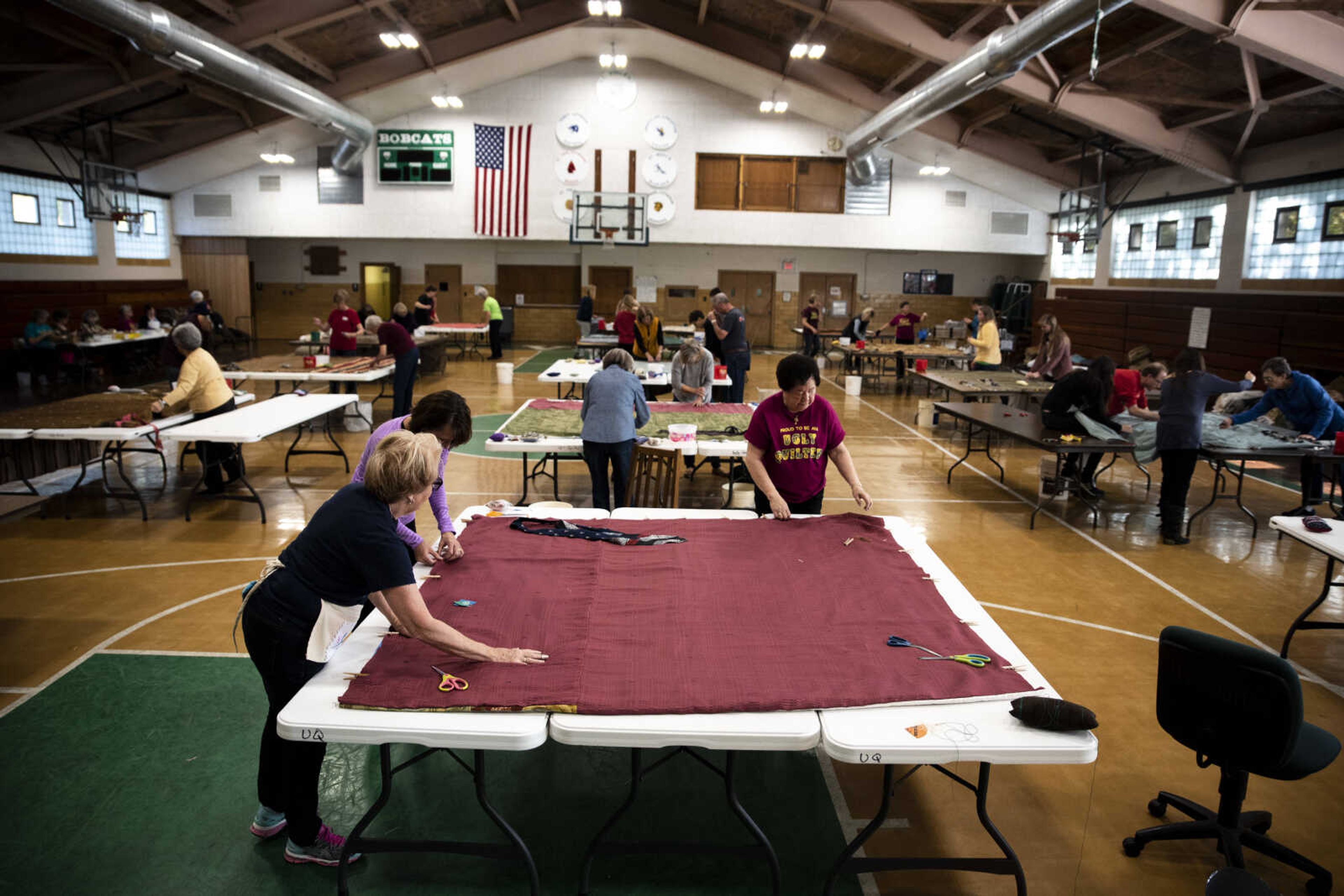 Dozens of community members gathered to tack quilts during the Ugly Quilt Weekend at St. Vincent de Paul Parish Sunday, Oct. 28, 2018, in Cape Girardeau.