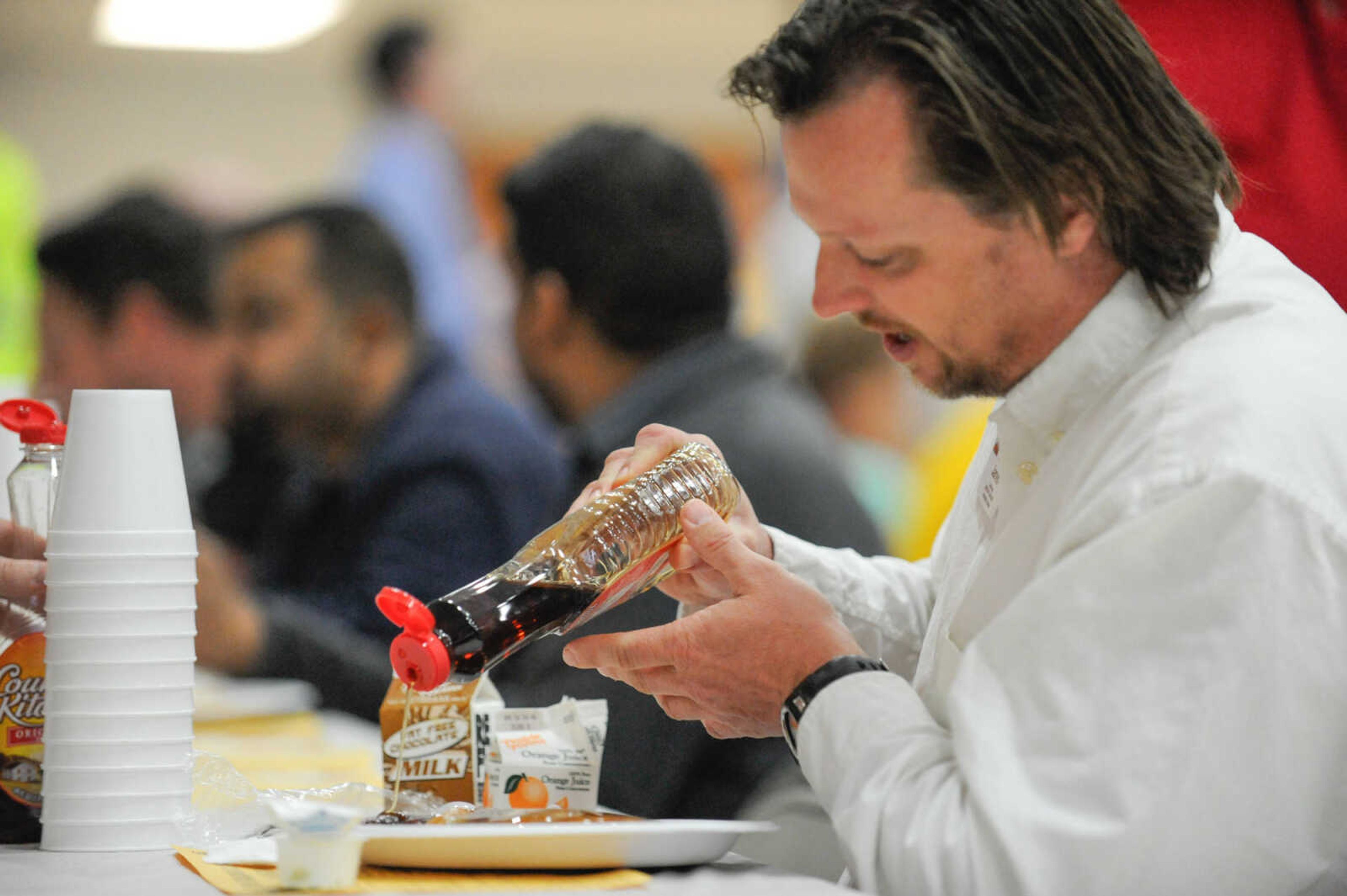 GLENN LANDBERG ~ glandberg@semissourian.com

Patrons dig into stacks of pancakes during the 78th annual Noon Lions Club Pancake Day Wednesday, March 9, 2016 at the Arena Building in Cape Girardeau.