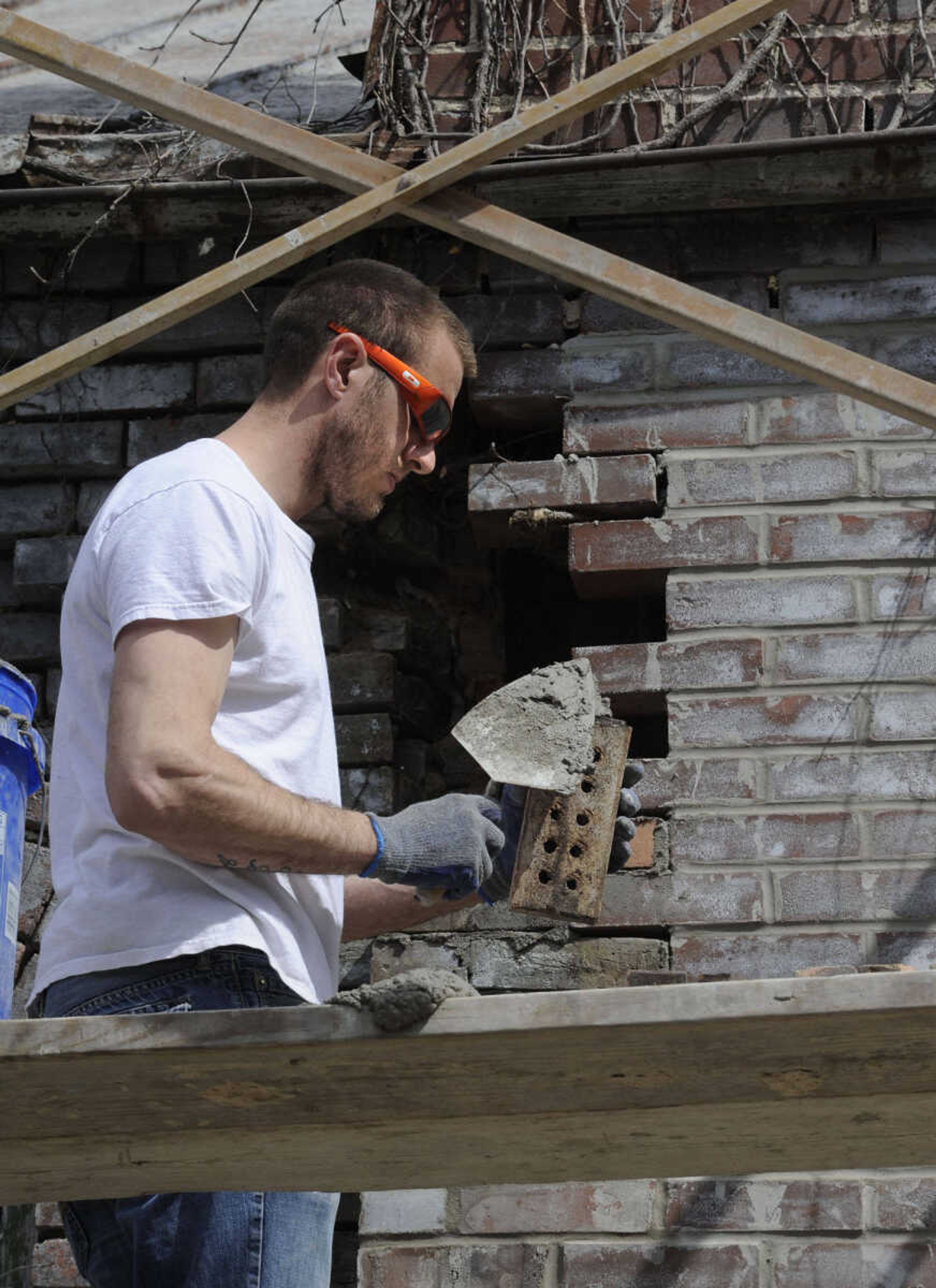 FRED LYNCH ~ flynch@semissourian.com
Wes Langston replaces some bricks in the chimney wall at the old Kage School on Monday, March 24, 2014 in Cape Girardeau.