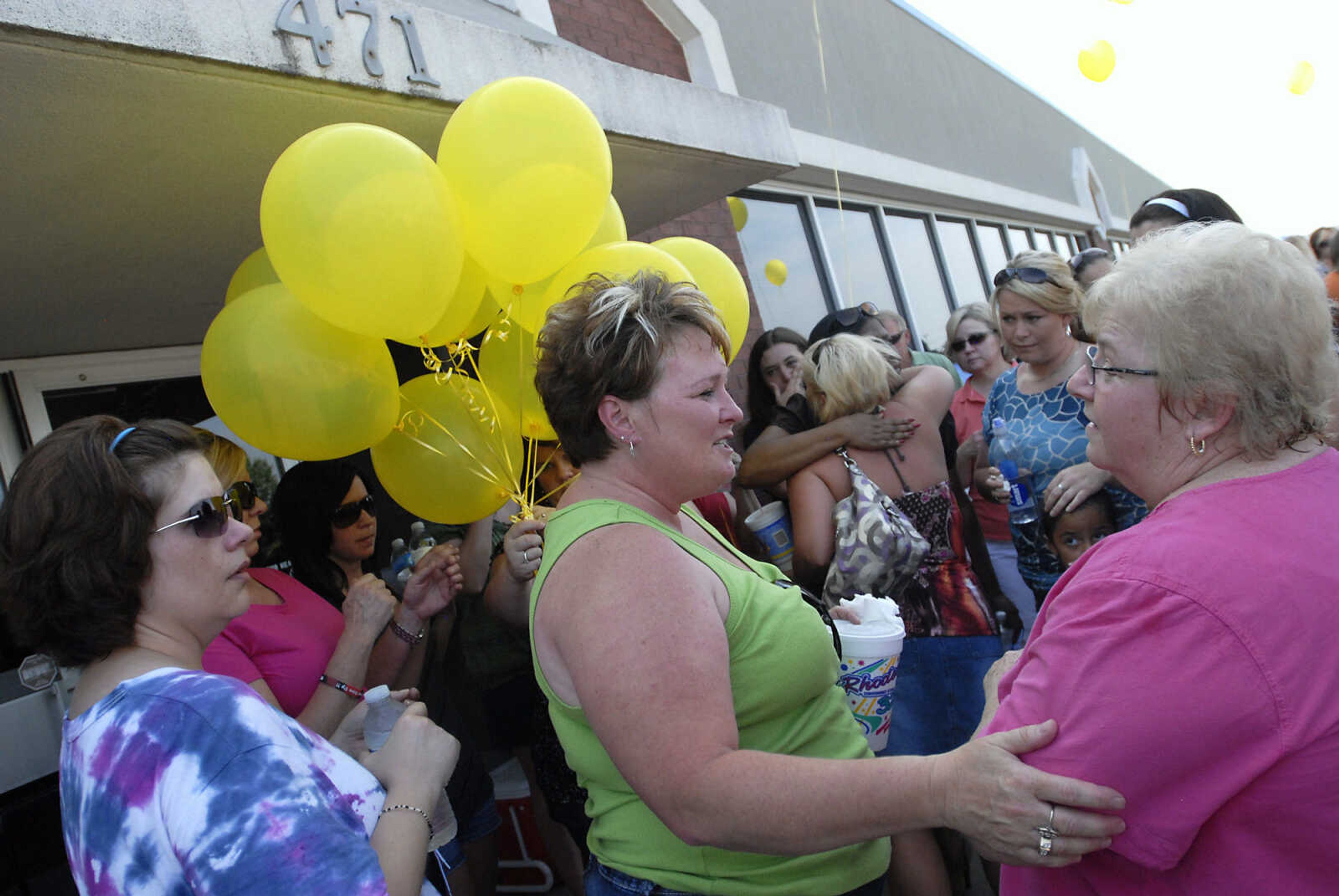 KRISTIN EBERTS ~ keberts@semissourian.com

Cheryl Brenneke, center, talks to friends during a prayer service for her sister, Jacque Sue Waller, at Anthem Blue Cross Blue Shield in Cape Girardeau on Saturday, June 4, 2011. Waller, a 39-year-old mother of three has been missing since Wednesday.