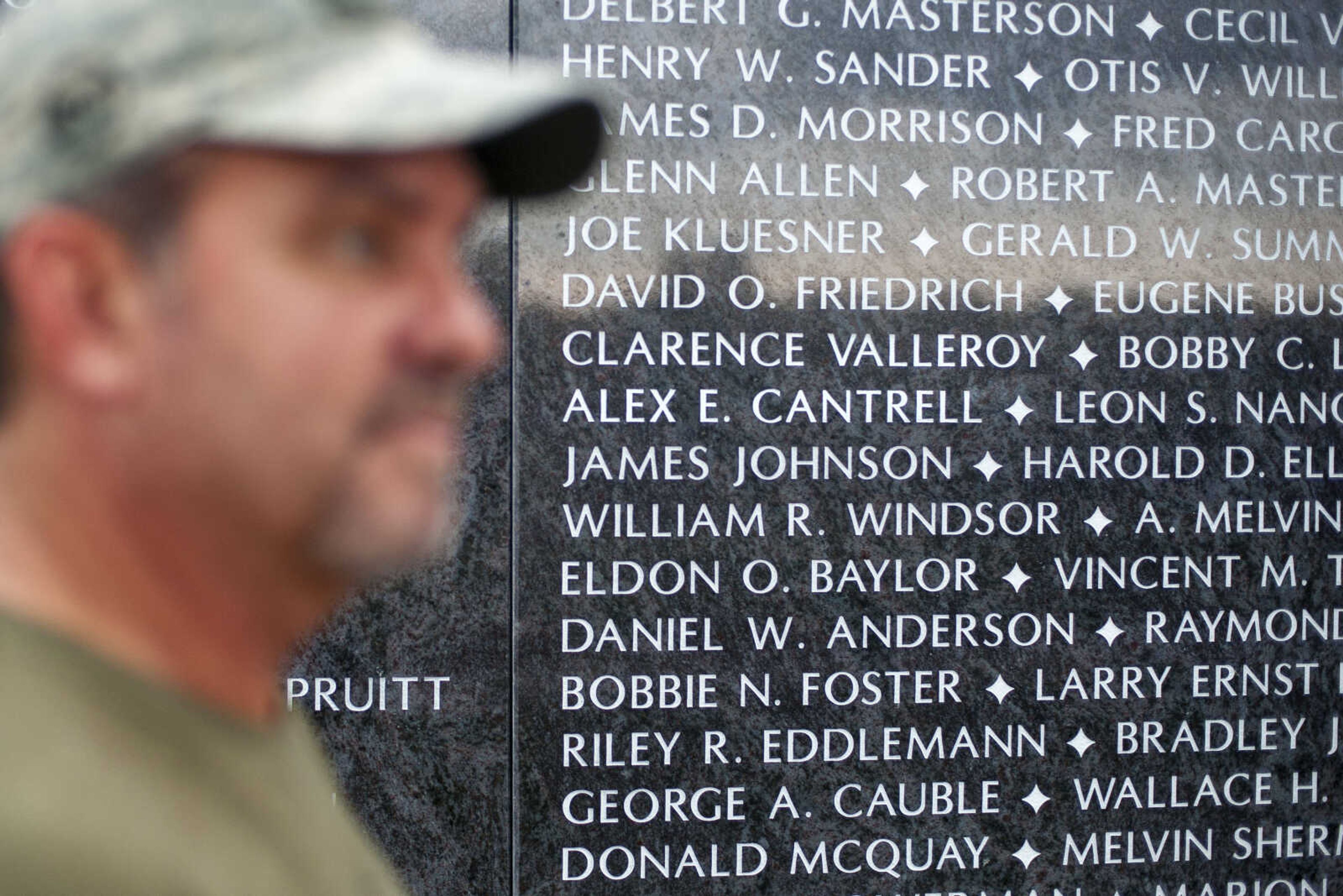 The name of David Cantrell's father, Alex Cantrell, is seen engraved in the wall on Tuesday, Aug. 20, 2019, at the Avenue of Flags in Cape Girardeau.