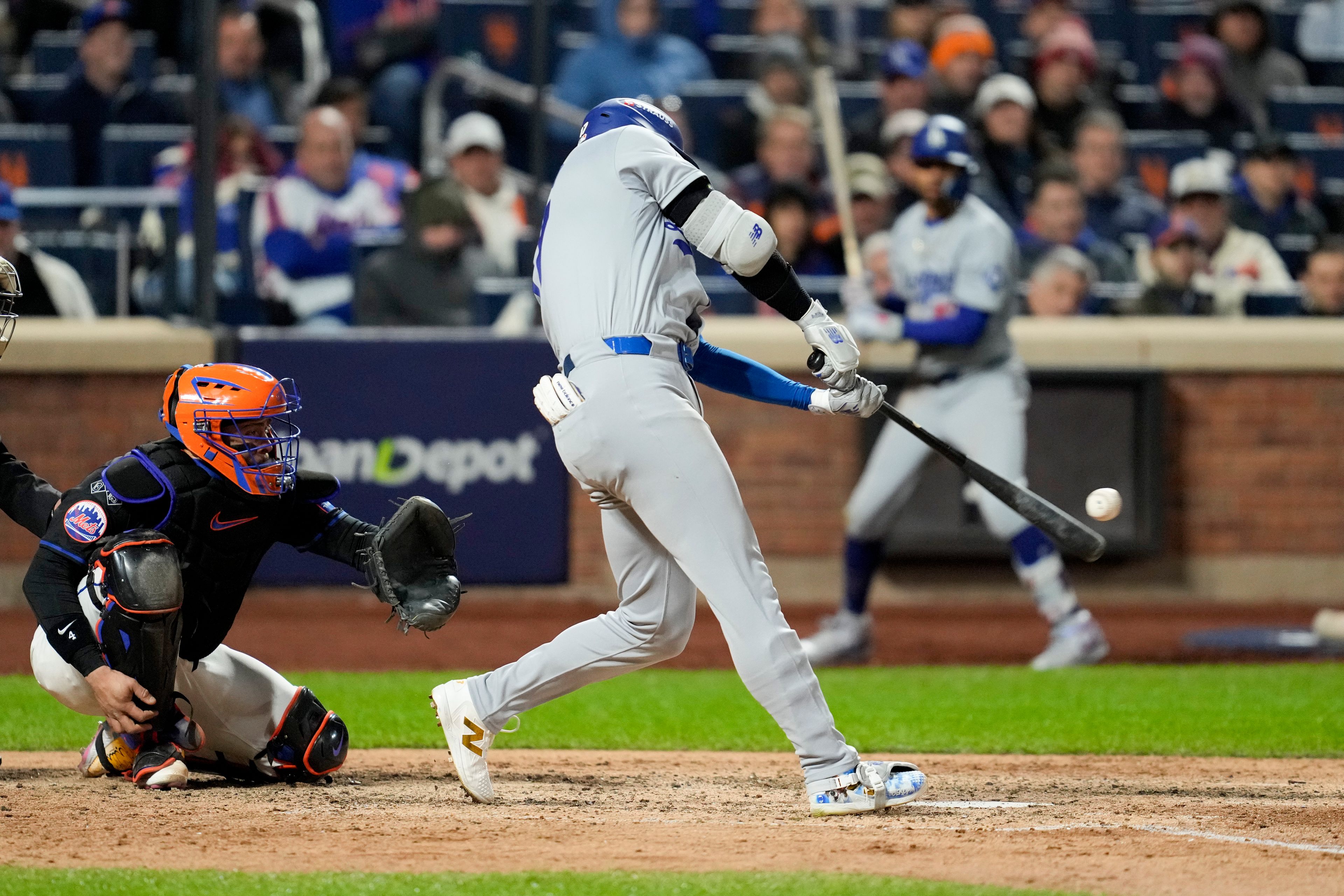 Los Angeles Dodgers' Shohei Ohtani hits a three-run home run against the New York Mets during the eighth inning in Game 3 of a baseball NL Championship Series, Wednesday, Oct. 16, 2024, in New York. (AP Photo/Ashley Landis)