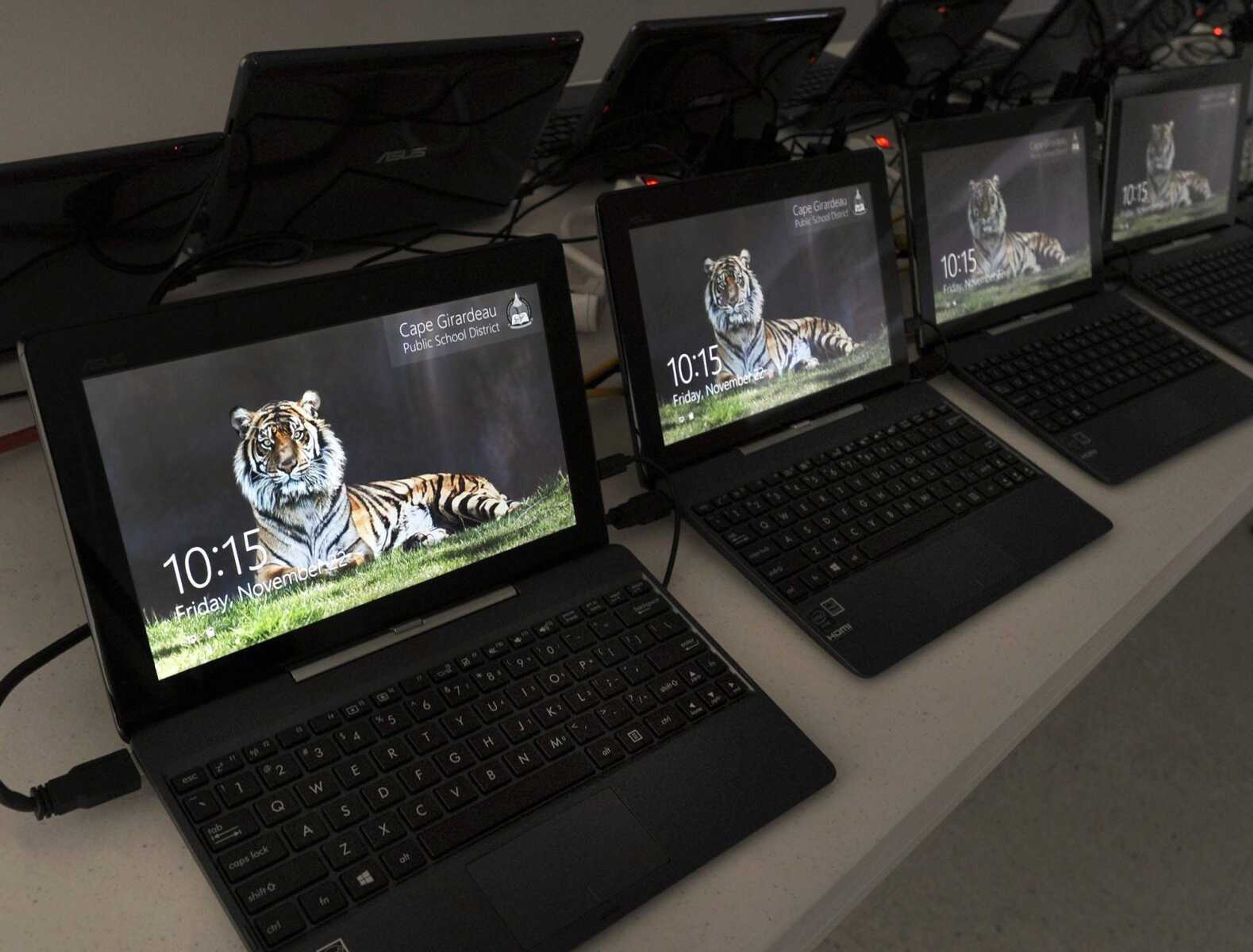 Convertible laptop computers are being loaded with software Friday, Nov. 22, 2013 for Central High School students to begin using in January. (Fred Lynch)