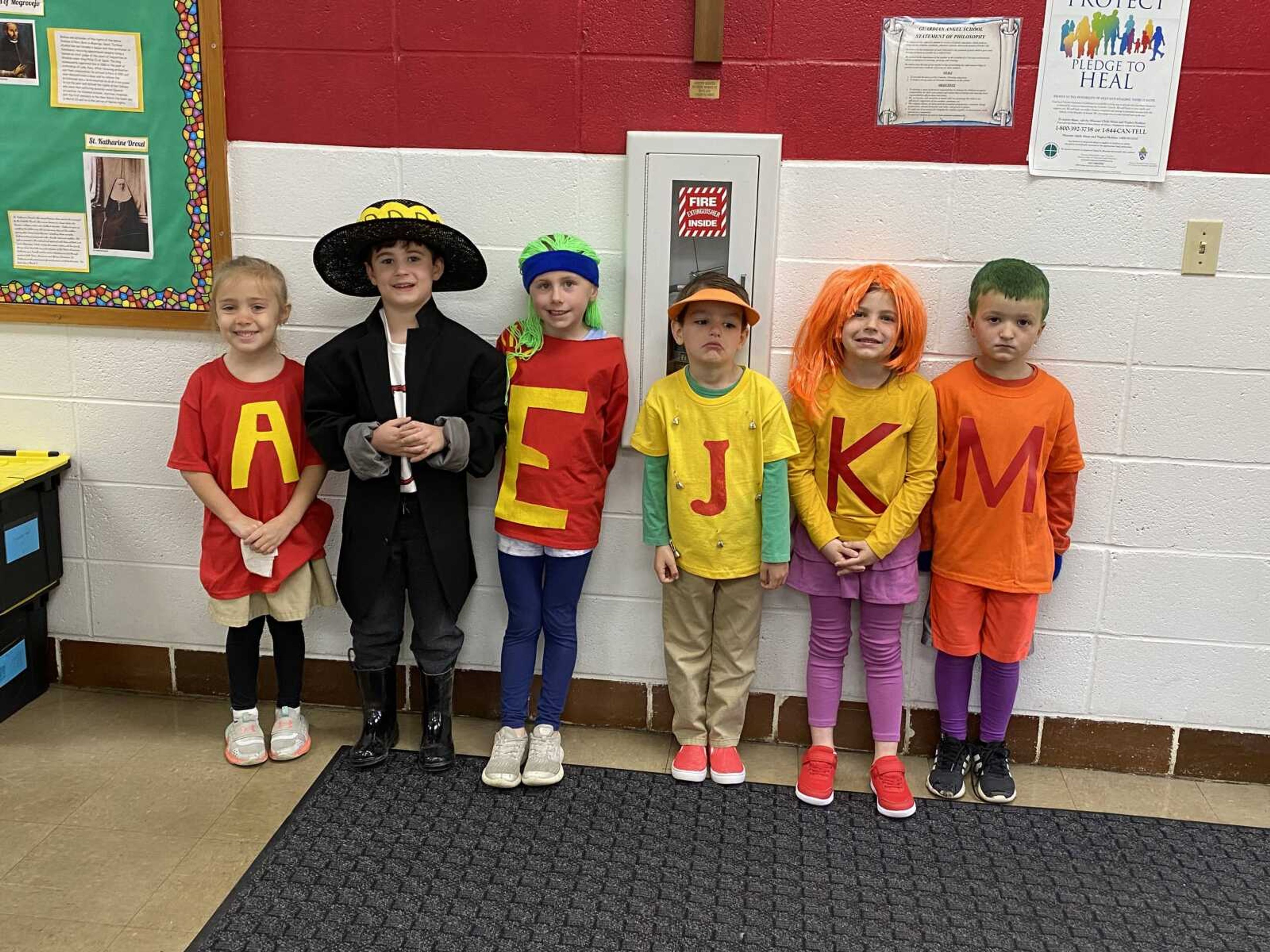 The Kindergarten students show off the creative designs that they wore for letter people week at Guardian Angel School in Oran.  Pictured are Amelia Kyle (Ahchoo!), Tripp McClard (Dazzling Dance), Aubrey Graviett (Exercise Energy), Jameson Vandergriff (Jingle Jacket), Kinsley Dunivan (Kaboom Kick), and Maverick Seabaugh (Munching Mouth).